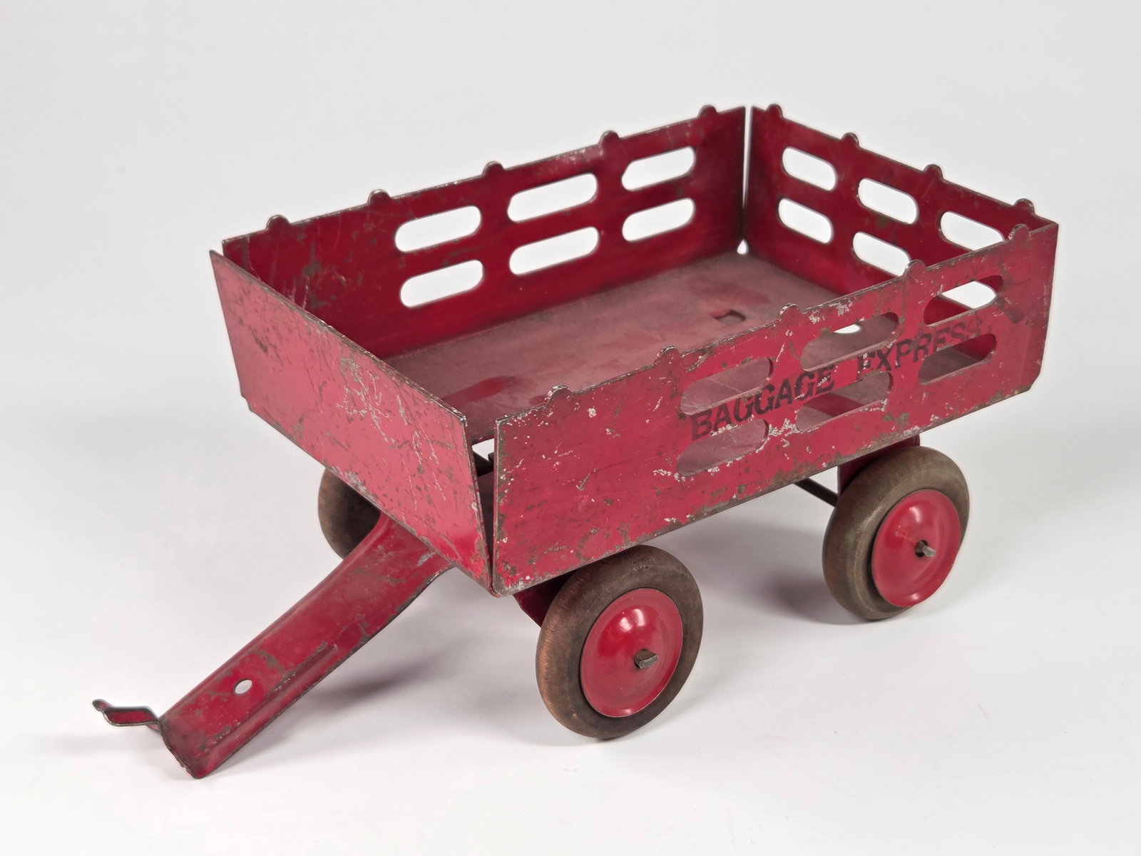 MARX PRESSED STEEL BAGGAGE EXPRESS STAKE BODY WAGON: REMAINS IN FAIR TO GOOD CONDITION, SHOWING SOME TYPICAL USAGE WEAR.