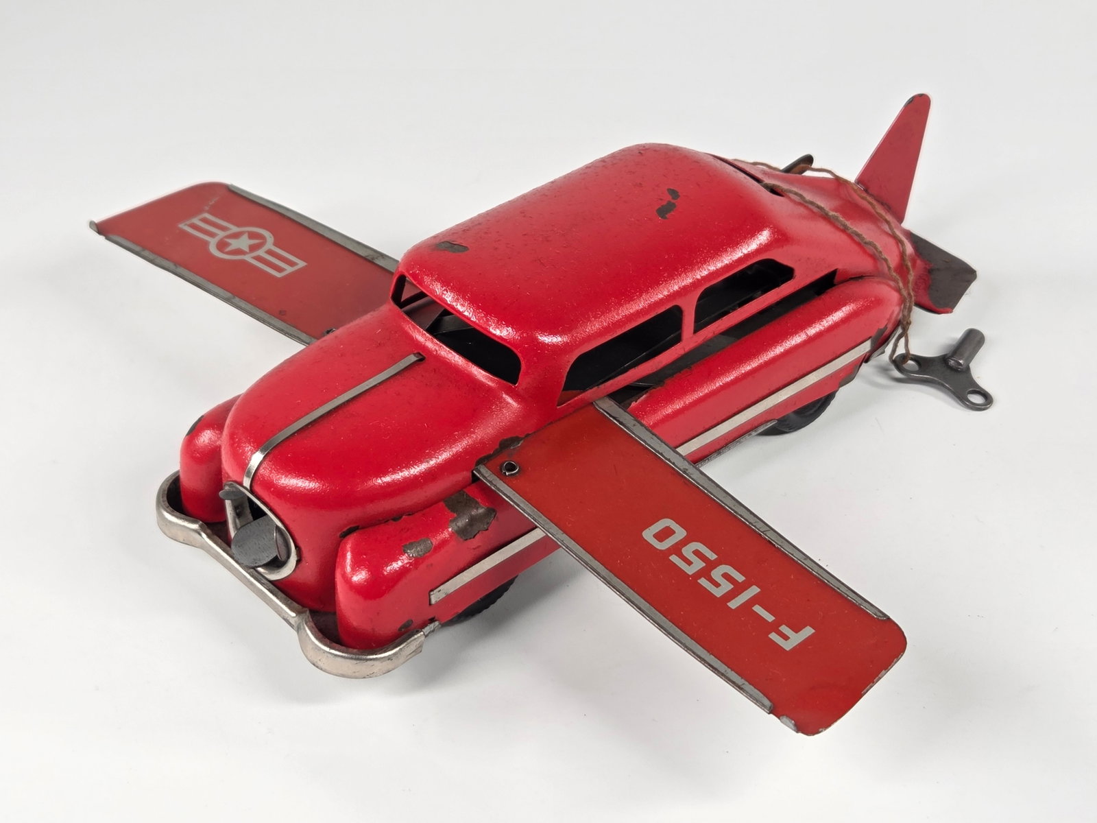 BLOMER & SCHULER FLYING AERO CAR: REMAINS IN FAIR TO GOOD CONDITION, SHOWING PAINT WEAR. KEY WIND MECHANISM SLUGGISH, WINGS INOPERABLE.