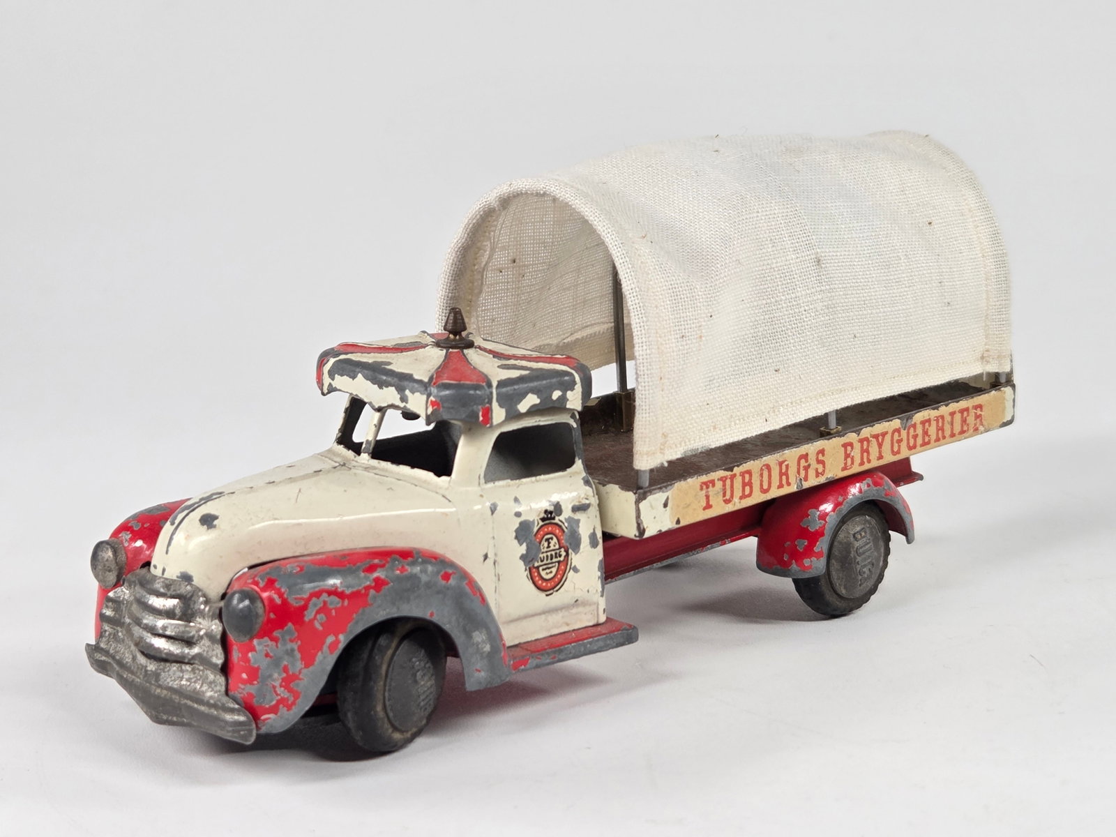 TEKNO DENMARK BUICK TUBORGS BRYGGERIER TRUCK: REMAINS IN FAIR CONDITION, SHOWING TYPICAL WEAR THROUGHOUT.