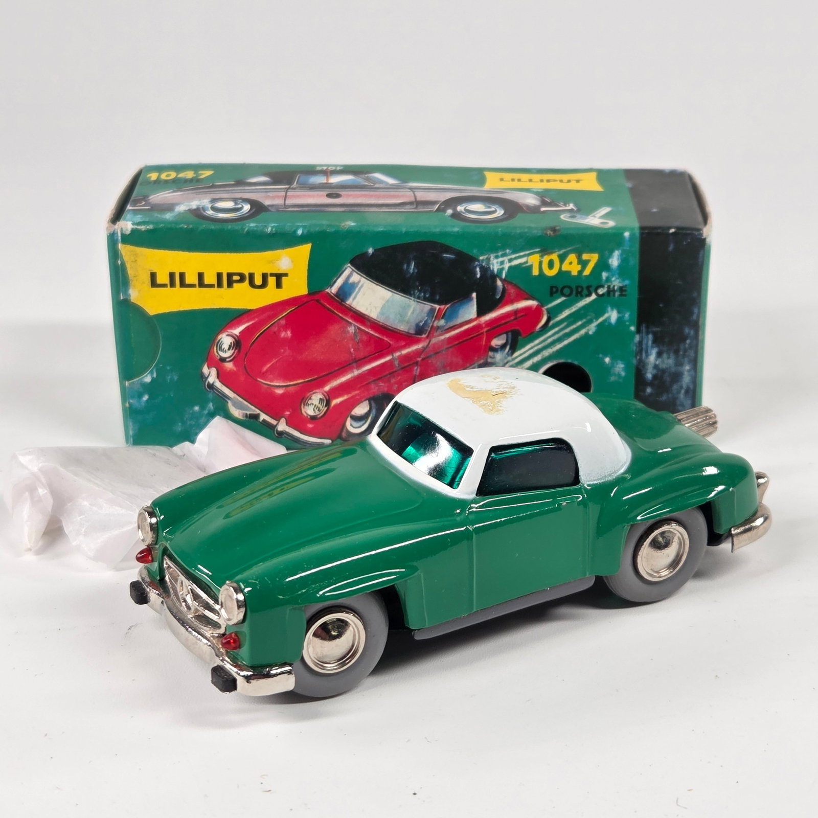 WESTERN GERMANY LILLIPUT 1047 PORSCHE W/ BOX: REMAINS IN GOOD CLEAN CONDITION. STICKER RESIDUE ON ROOF, NEEDS CLEANED. BOX SHOWING WEAR.