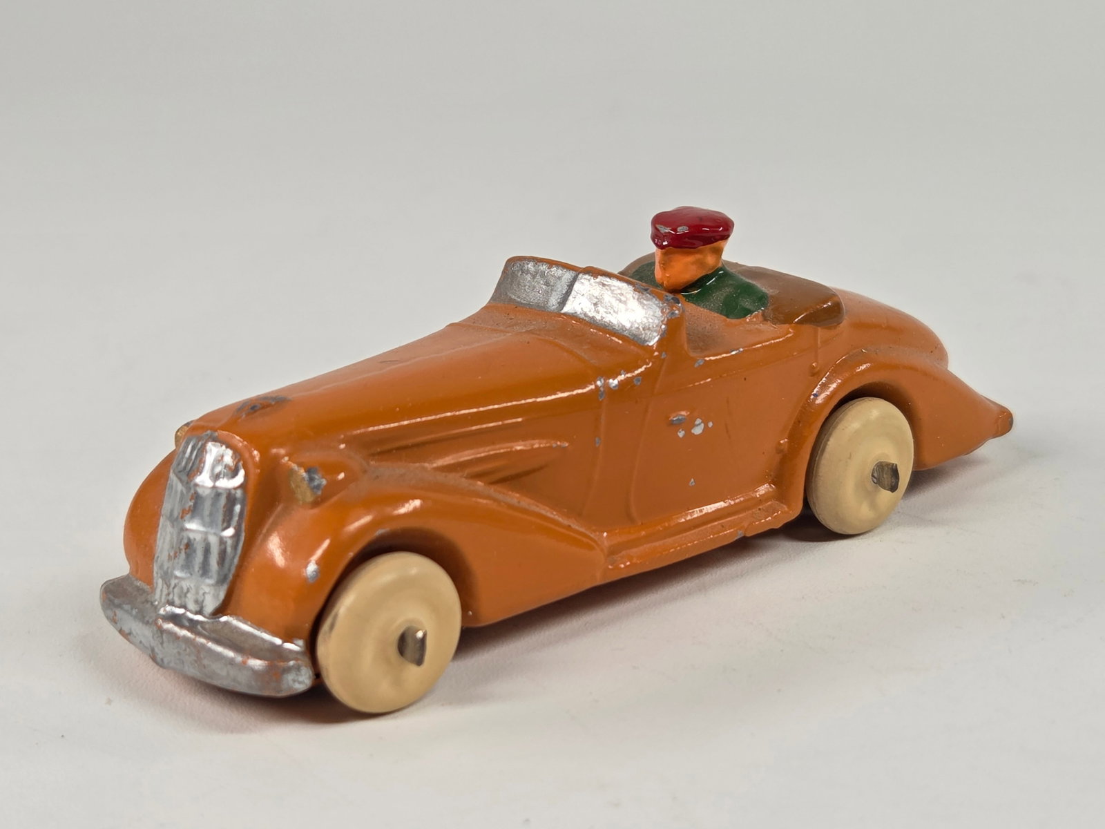 RECAST SLUSH METAL CONVERTIBLE W/ DRIVER: REMAINS IN VERY GOOD CONDITION, SHOWING SOME LIGHT PAINT WEAR.