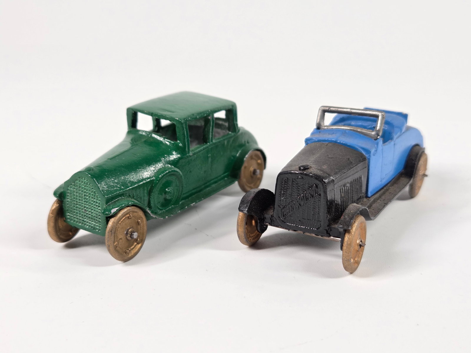 PAIR OF RECAST SLUSH METAL AUTOMOBILES: BOTH REMAIN IN GOOD CONDITION, SHOWING SOME LIGHT WEAR.