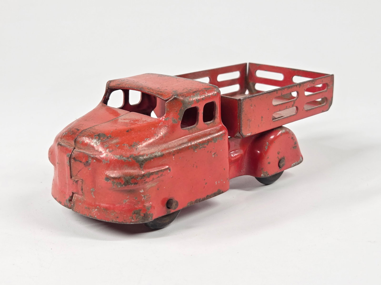 WYANDOTTE PRESSED STEEL STAKE BODY TRUCK: REMAINS IN FAIR TO GOOD CONDITION, SHOWING TYPICAL WEAR.
