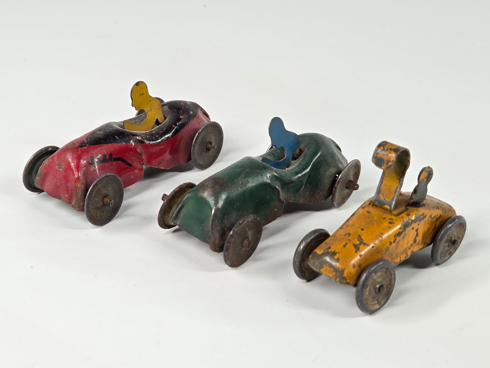 3) SMALL MINIATURE PRESSED STEEL RACE CARS: ALL REMAIN IN FAIR TO GOOD CONDITION, SHOWING SOME TYPICAL WEAR.