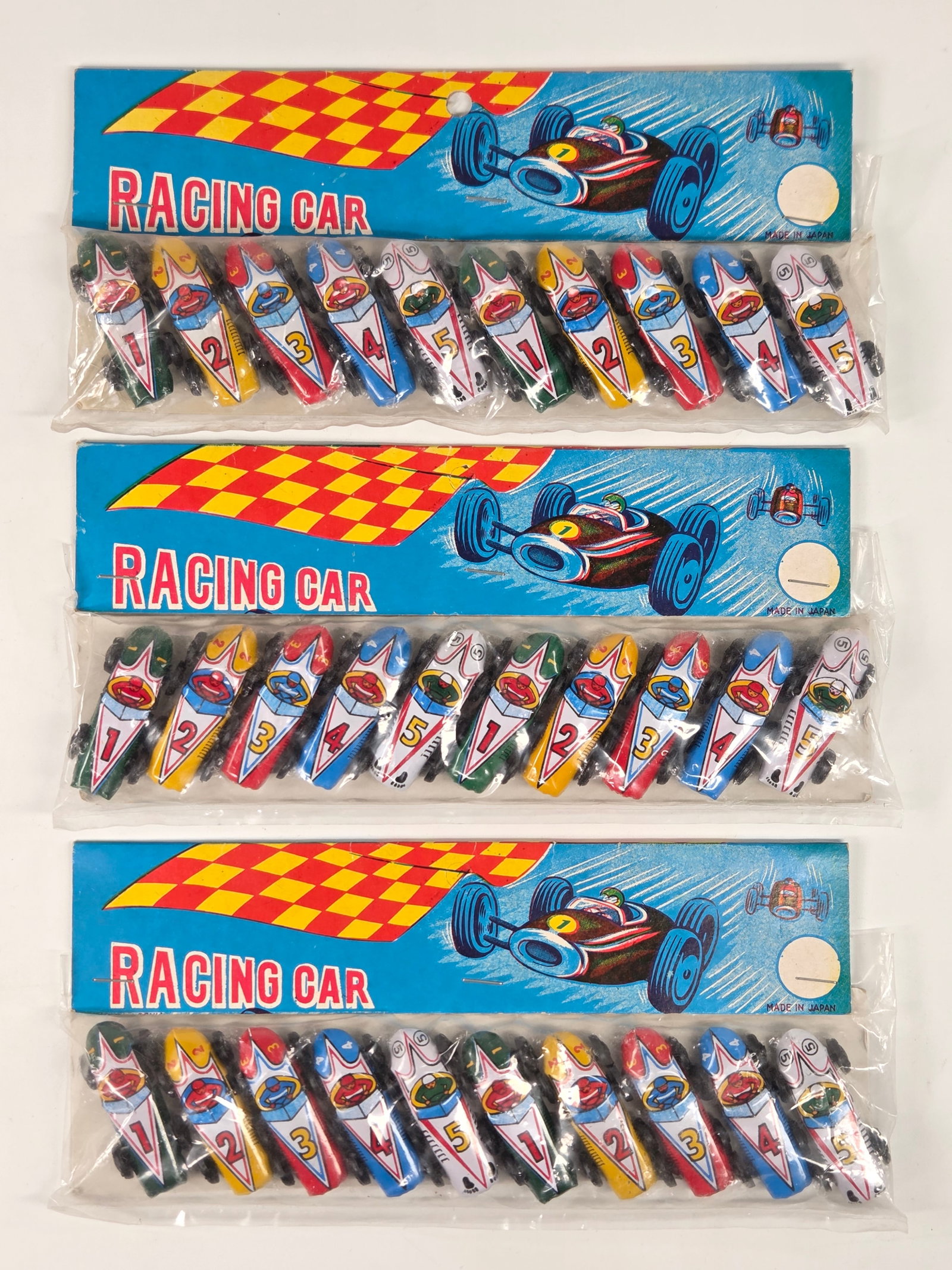 3) PACKS JAPAN TIN LITHO RACING CARS: ALL REMAIN NEW IN PACKAGE.