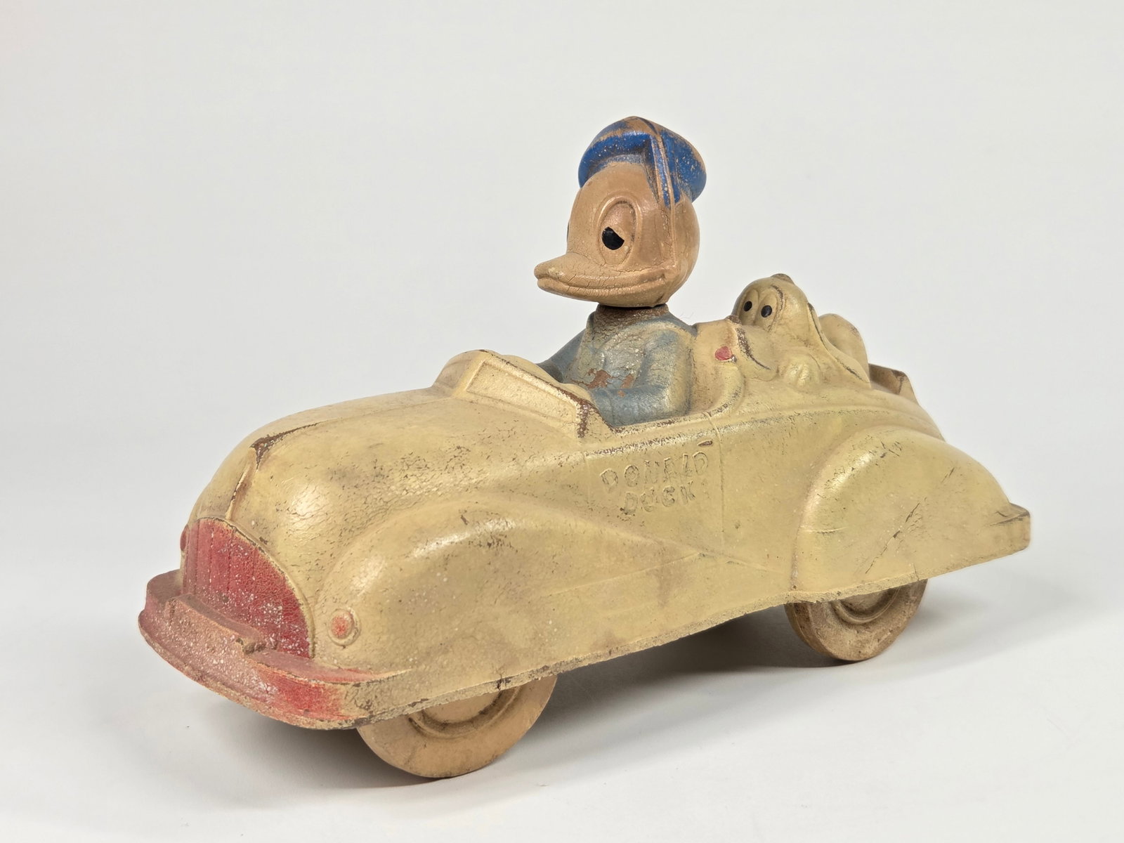 SUN RUBBER DONALD DUCK CONVERTIBLE: REMAINS IN FAIR TO GOOD CONDITION, SHOWING SOME TYPICAL WEAR.