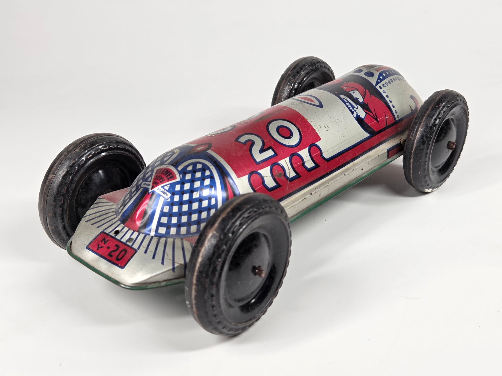 ELENEE TOYS INC. PRESSED STEEL RACE CAR: REMAINS IN GOOD CONDITION, SHOWING SOME LIGHT WEAR.