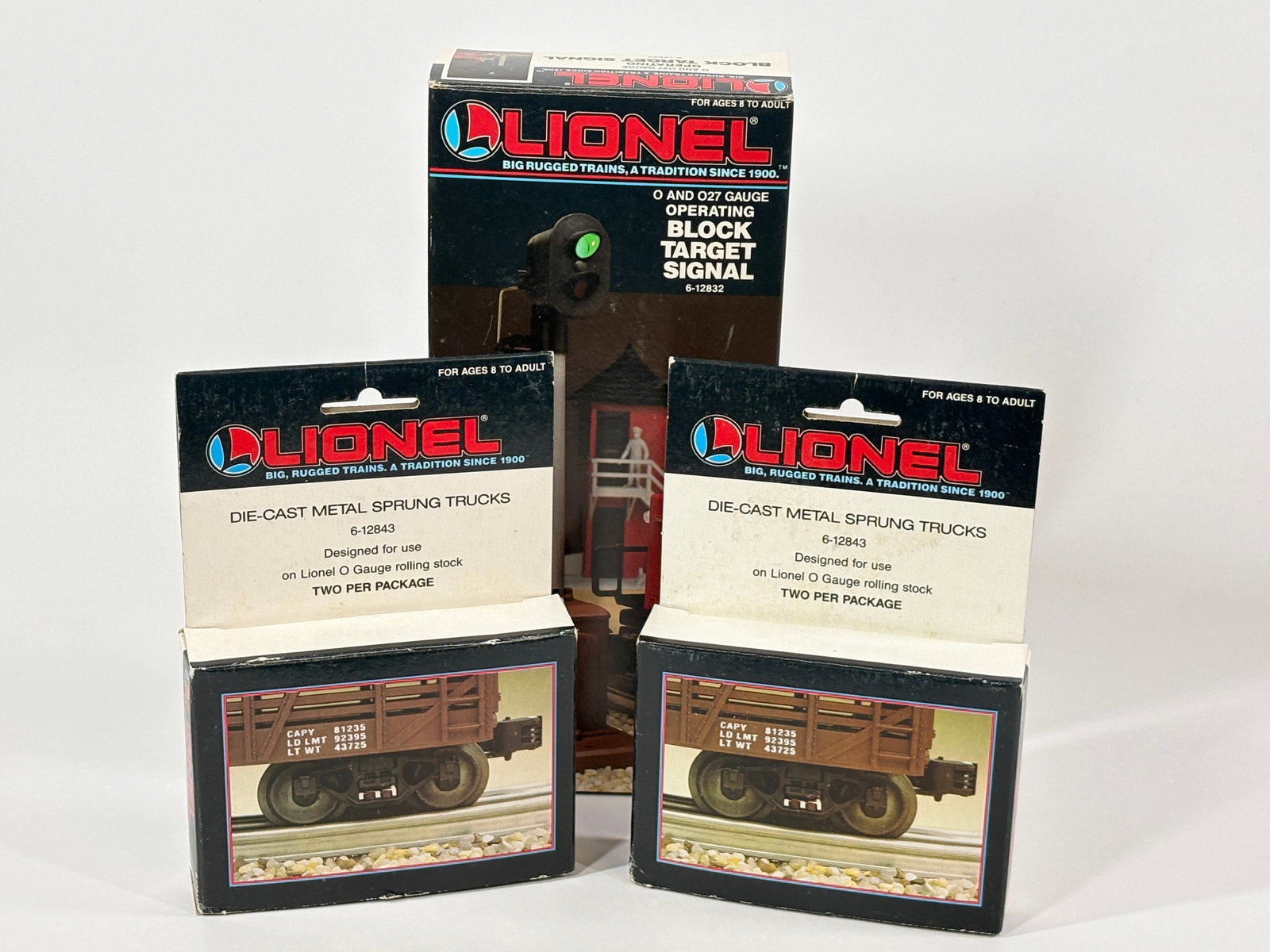 2) LIONEL 6-12843 SPRUNG TRUCKS & 1) BLOCK TARGET SIGNAL: ALL REMAIN IN EXCELLENT CONDITION WITH BOX.