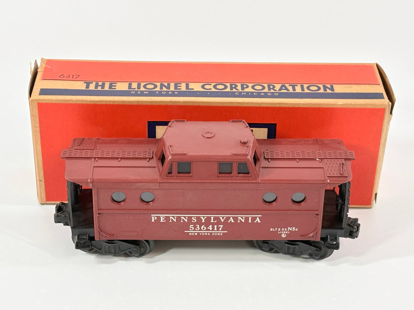 LIONEL O GAUGE NO. 6417 PENNSYLVANIA CABOOSE: BOX AND CAR BOTH REMAIN IN GOOD CONDITION, SHOWING SOME TYPICAL WEAR.