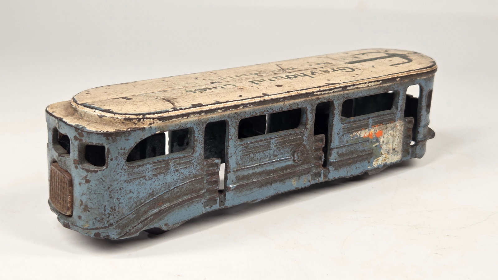 ARCADE CAST IRON WORLD'S FAIR GREYHOUND BUS LINES: REMAINS IN FAIR TO GOOD CONDITION, SHOWING WEAR THROUGHOUT.