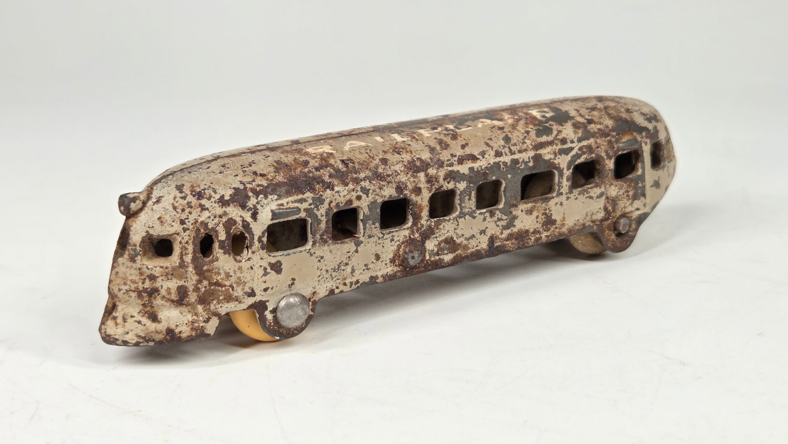 ARCADE CAST IRON RAILPLANE STREAMLINE TRAIN: REMAINS IN FAIR TO GOOD CONDITION, SHOWING PAINT WEAR THROUGHOUT. WHEELS HAVE BEEN REPLACED.