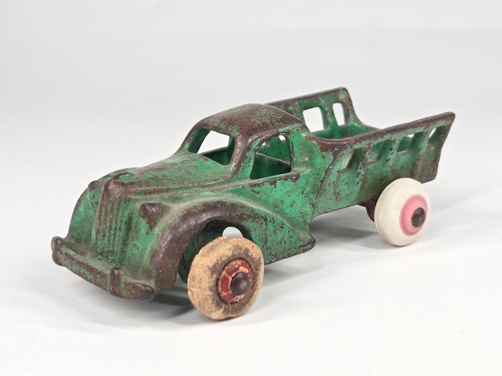 HUBLEY CAST IRON STAKE BODY TRUCK: REMAINS IN FAIR TO GOOD CONDITION, SHOWING PAINT WEAR. WHEELS REPLACED.