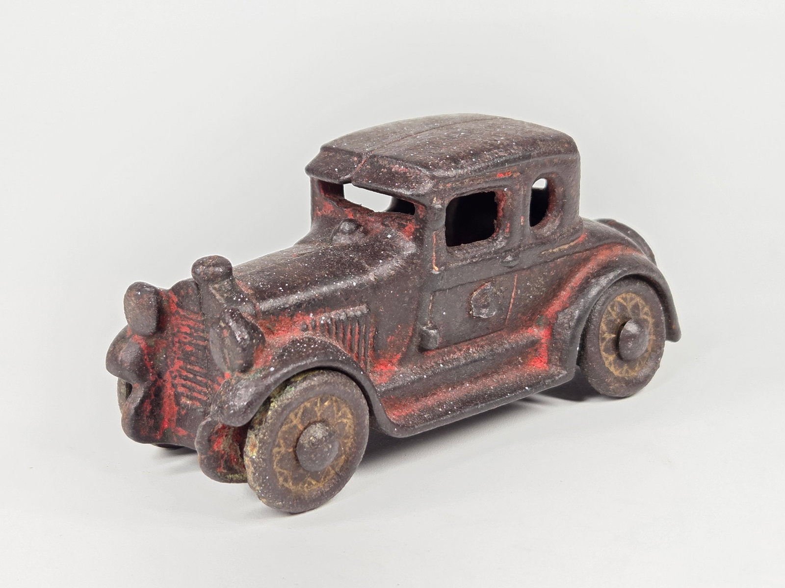 AC WILLIAMS CAST IRON COUPE: REMAINS IN FAIR CONDITION, SHOWING WEAR THROUGHOUT.