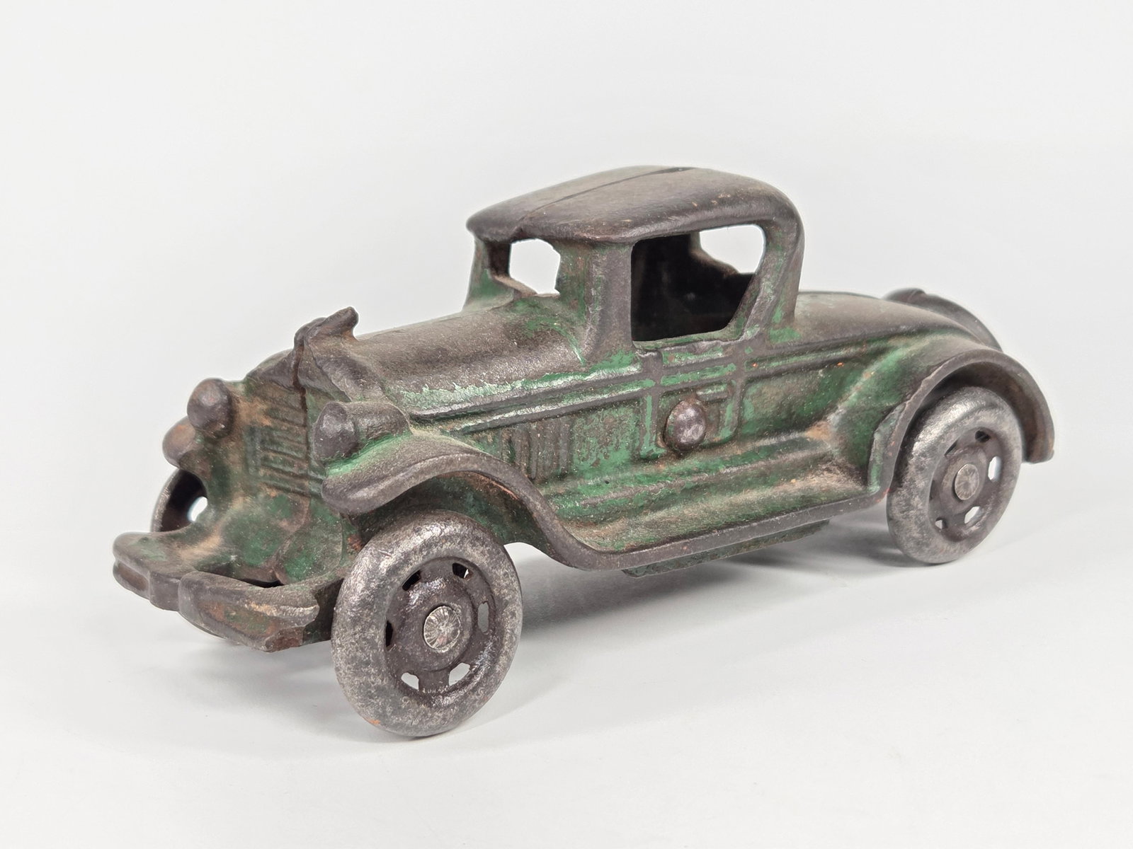 AC WILLIAMS CAST IRON COUPE: REMAINS IN FAIR CONDITION, SHOWING PAINT WEAR THROUGHOUT.