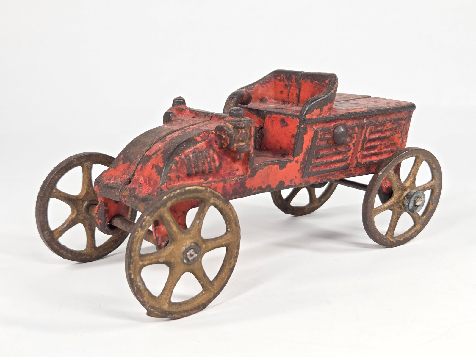 ANTIQUE CAST IRON HORSELESS CARRIAGE: REMAINS IN FAIR CONDITION, SHOWING PAINT WEAR.