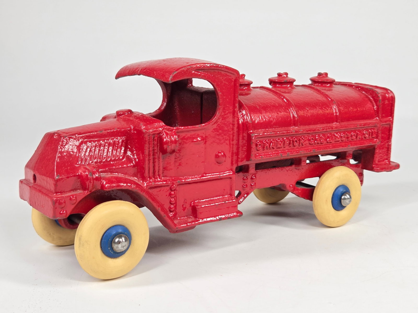 RESTORED CHAMPION CAST IRON GAS & MOTOR OIL TANKER: REMAINS IN GOOD RESTORED CONDITION, SHOWING SOME LIGHT PAINT WEAR.