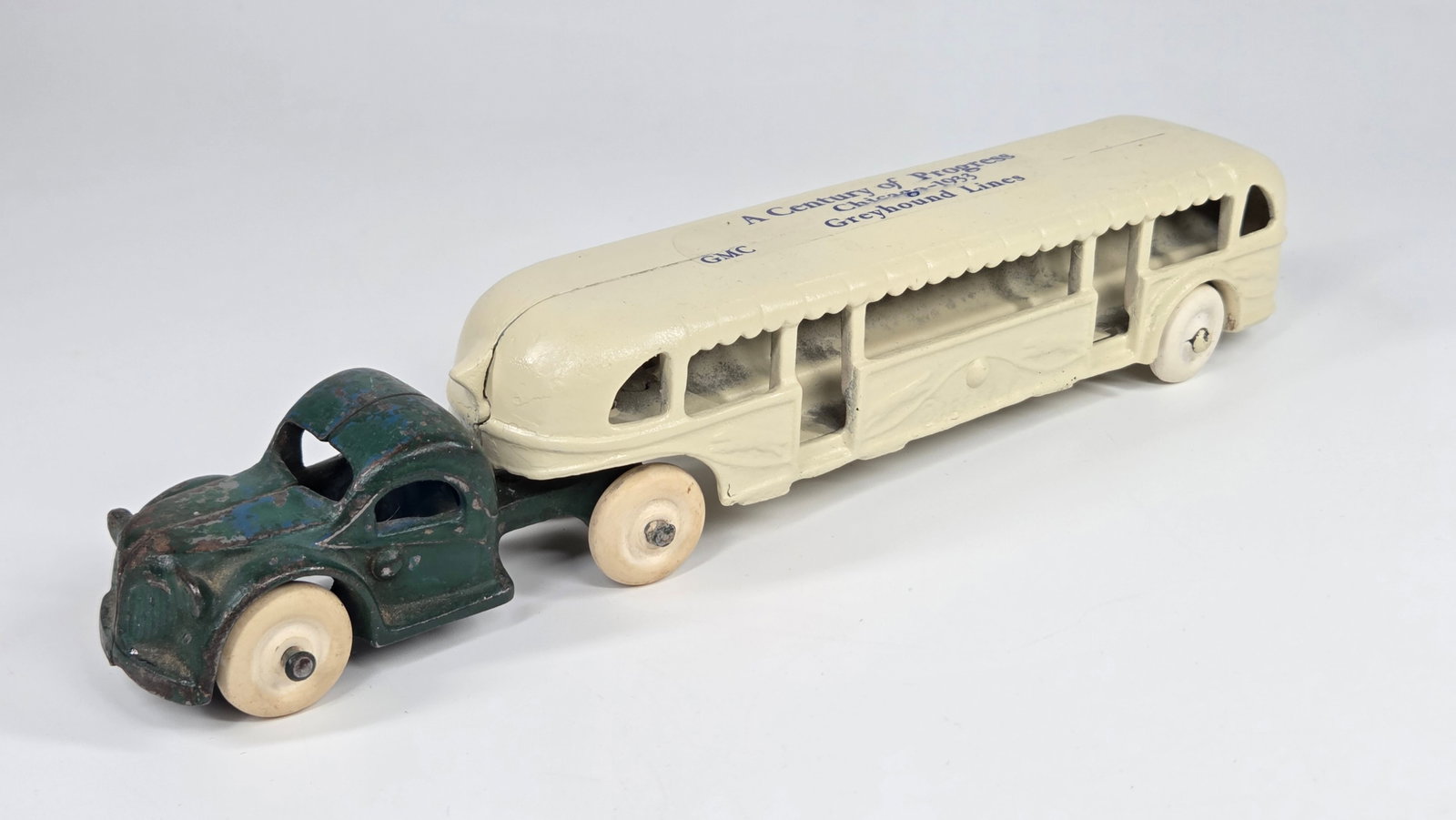 PAINTED ARCADE CAST IRON WORLD'S FAIR BUS.: REMAINS IN FAIR CONDITION, SHOWING PAINT WEAR WITH PAINT APPLIED.