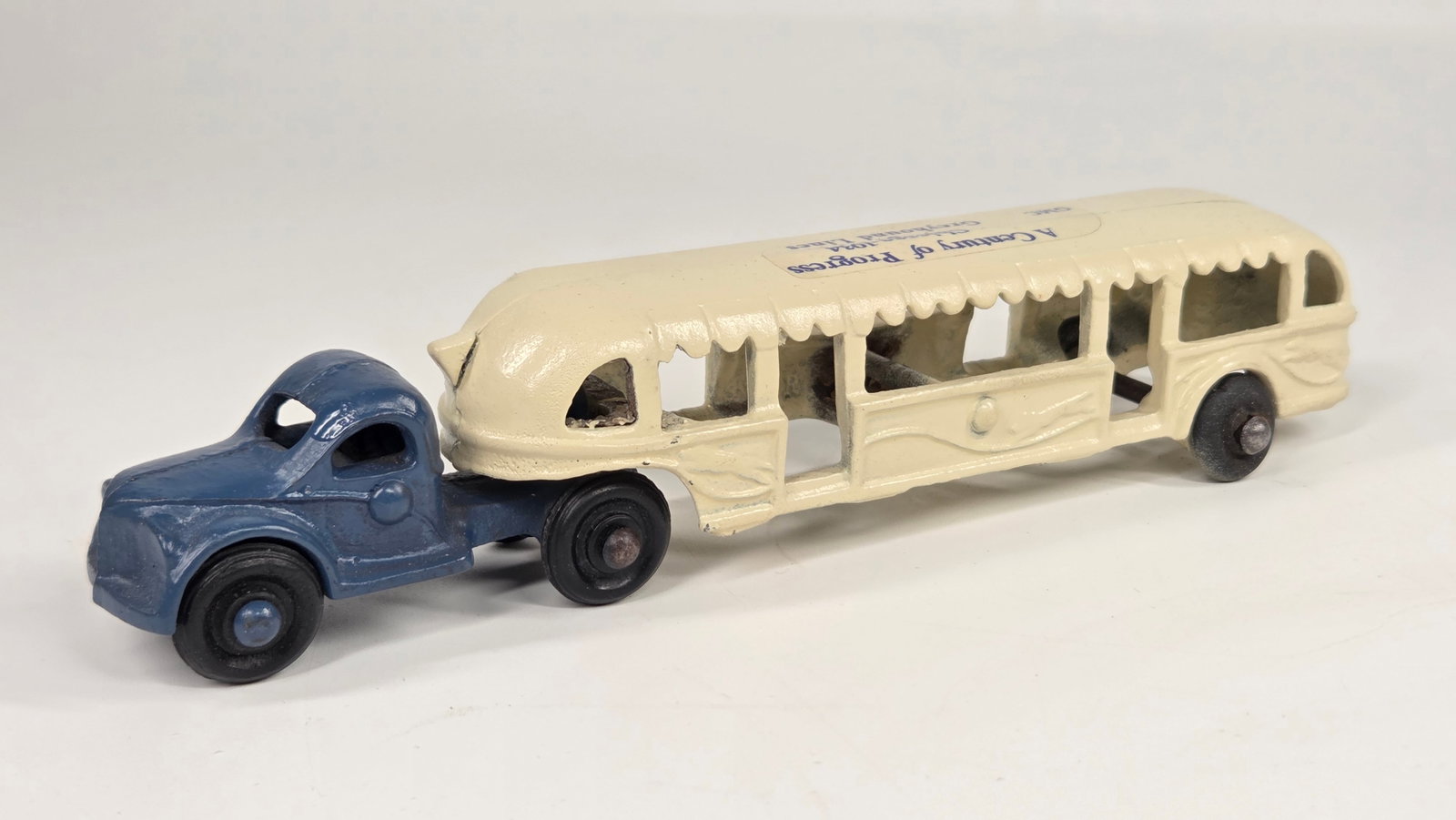 PAINTED ARCADE CAST IRON WORLD'S FAIR BUS.: REMAINS IN FAIR CONDITION, SHOWING PAINT WEAR WITH PAINT APPLIED.