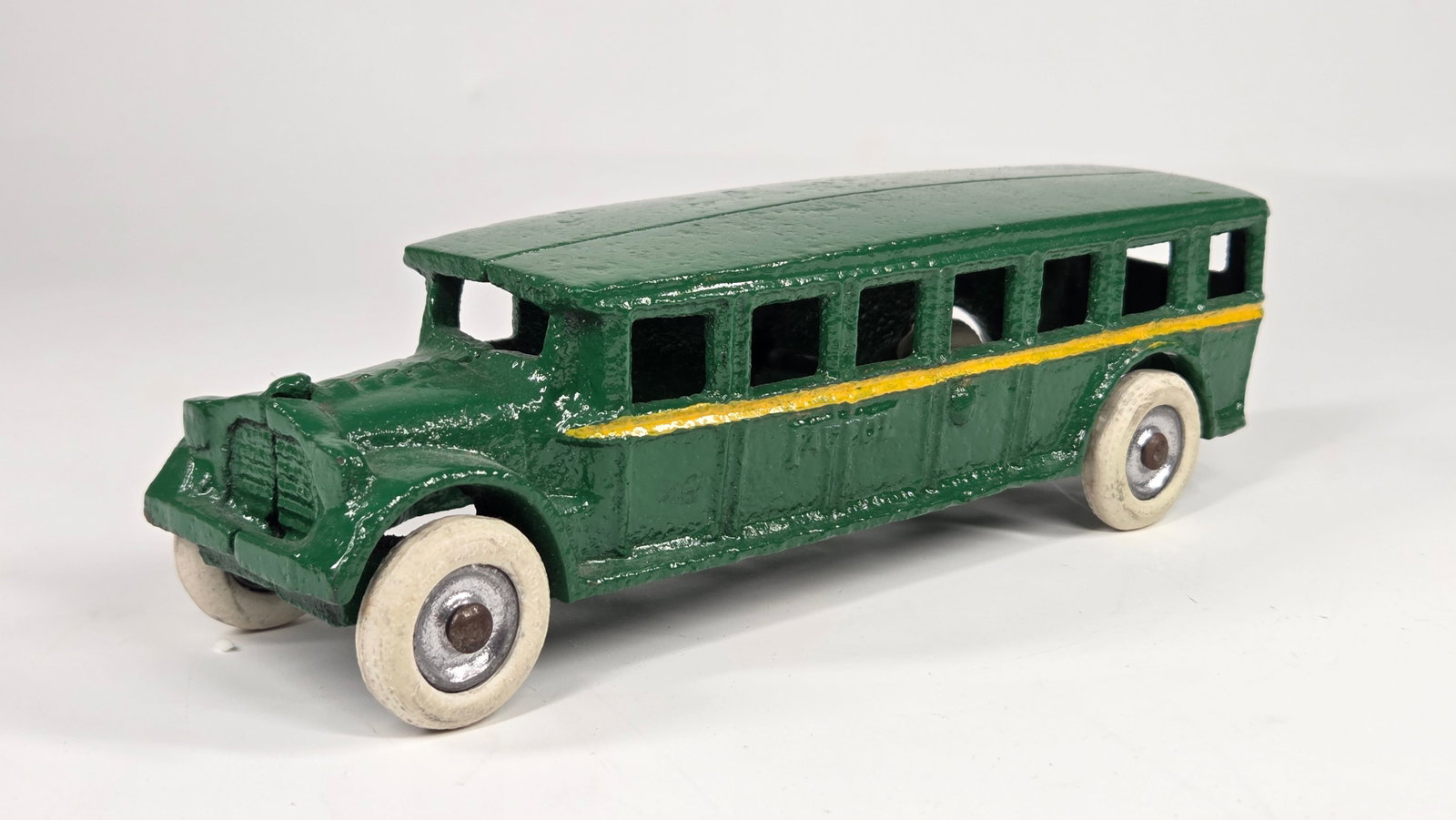 PAINTED ARCADE CAST IRON FAGEOL COACH BUS: REMAINS IN GOOD PAINTED CONDITION, SHOWING SOME WEAR.