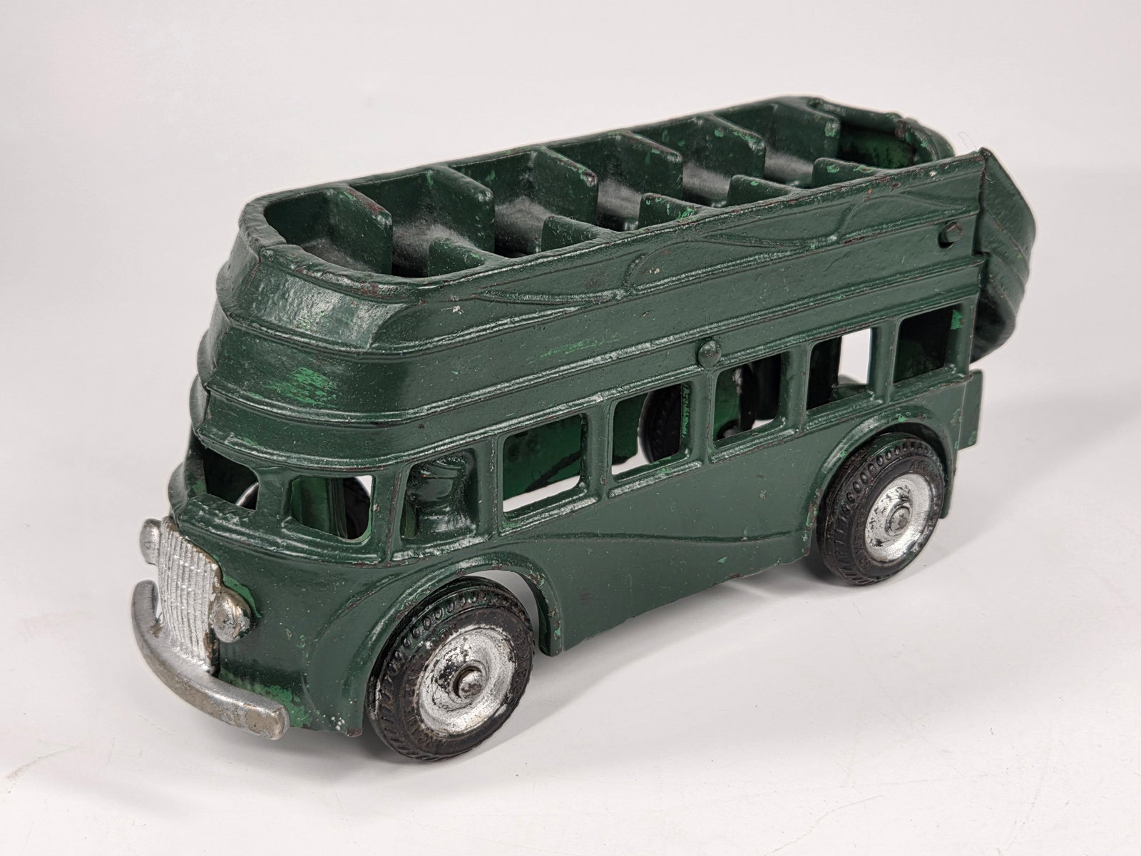 PAINTED ARCADE CAST IRON DOUBLE DECKER BUS: REMAINS IN FAIR CONDITION, SHOWING WEAR. PAINTED OVER.