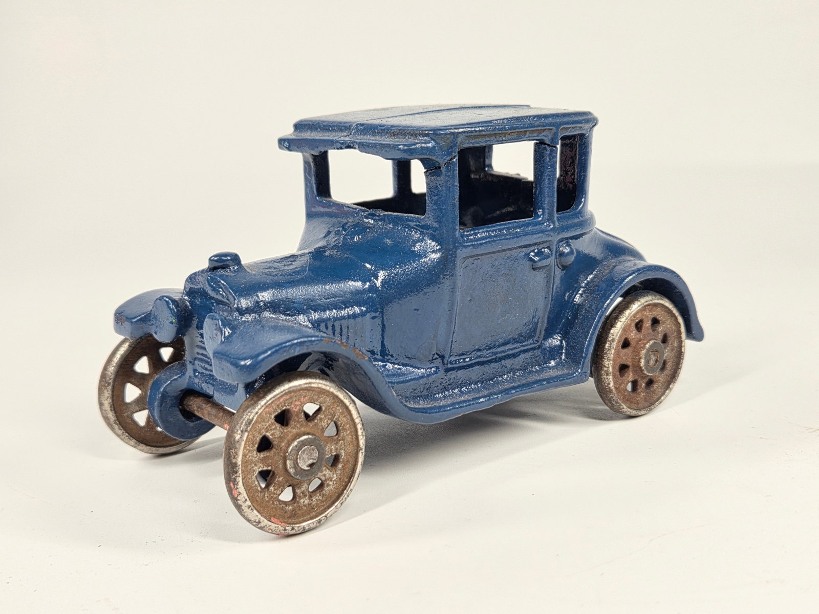 PAINTED AC WILLIAMS CAST IRON FORD COUPE: REMAINS IN GOOD REPAINTED CONDITION.
