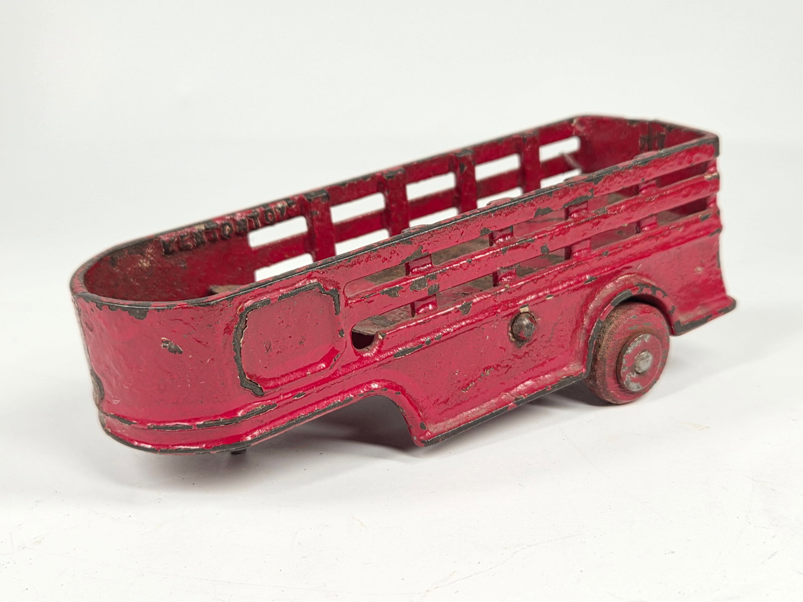KENTON TOYS CAST IRON STAKE BODY TRAILER: REMAINS IN FAIR CONDITION, HOWEVER THE ENTIRE TRAILER PAINTED OVER RED.