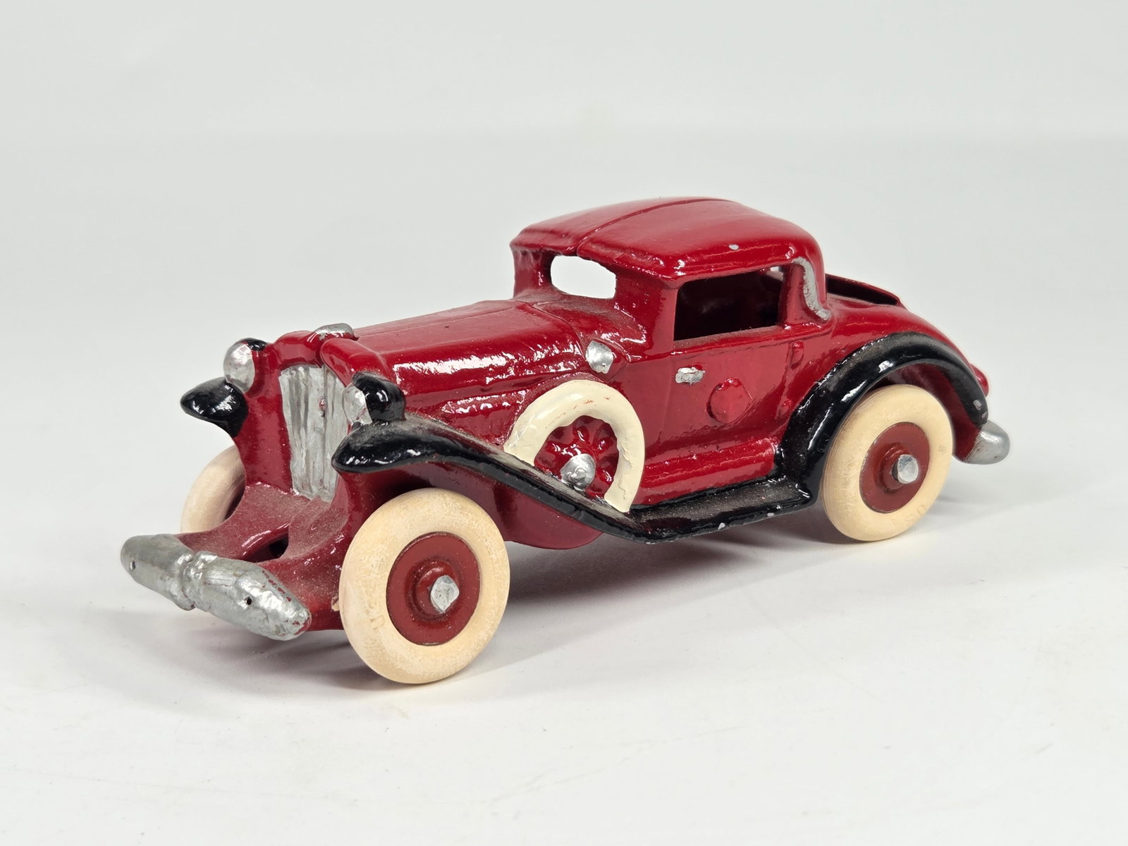 CUSTOM HAND PAINTED CAST IRON RECAST W/ RUMBLE SEAT: REMAINS IN VERY GOOD CONDITION, SHOWING SOME LIGHT WEAR. DUSTY, NEEDING CLEANED.