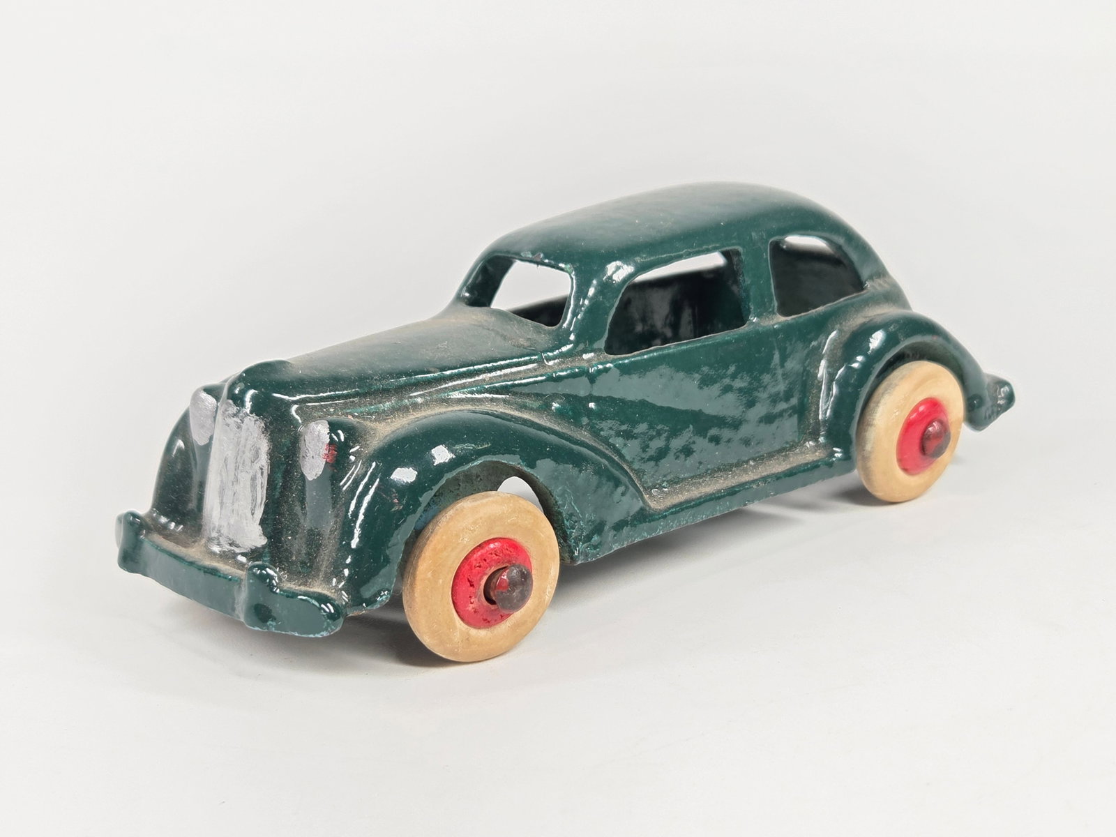 PAINTED HUBLEY CAST IRON SEDAN: REMAINS IN GOOD COMPLETELY REPAINTED CONDITION. WHEELS REPLACED.
