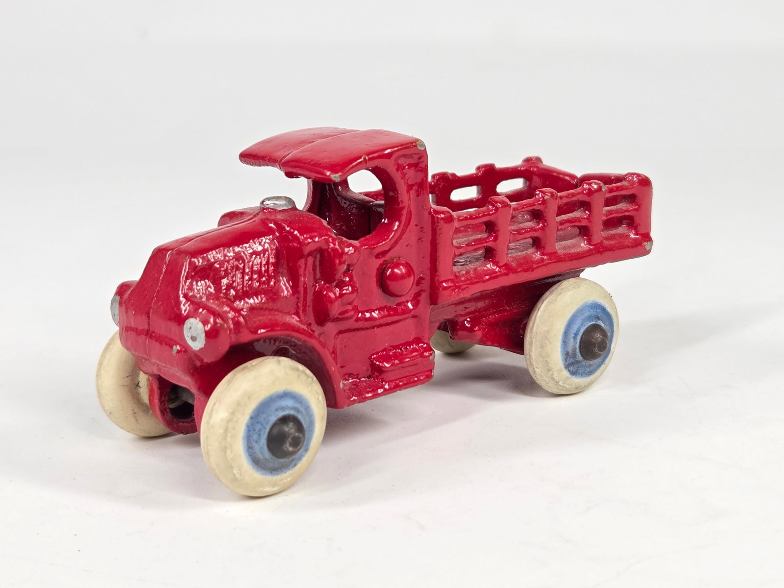 RESTORED CAST IRON MACK CAB STAKE BODY TRUCK: REMAINS IN GOOD RESTORED CONDITION, SHOWING SOME LIGHT WEAR.