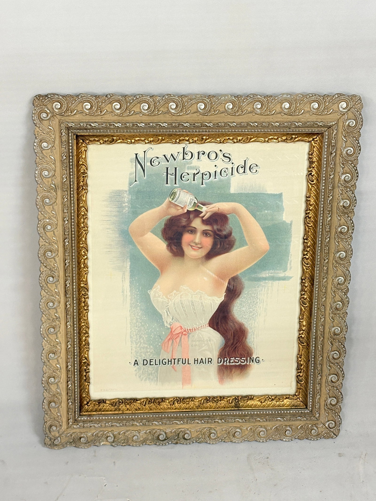 NEWBRO'S HERPICIDE GIRL HAIRDRESSING ADVERTISING POSTER: ATTRACTIVE HERPICIDE GIRL ADVERTISING POSTER - LIMITED EDITION PRINT FROM THE BRODERSON COLLECTION. REMAINS IN VERY GOOD CONDITION IN PERIOD FRAME