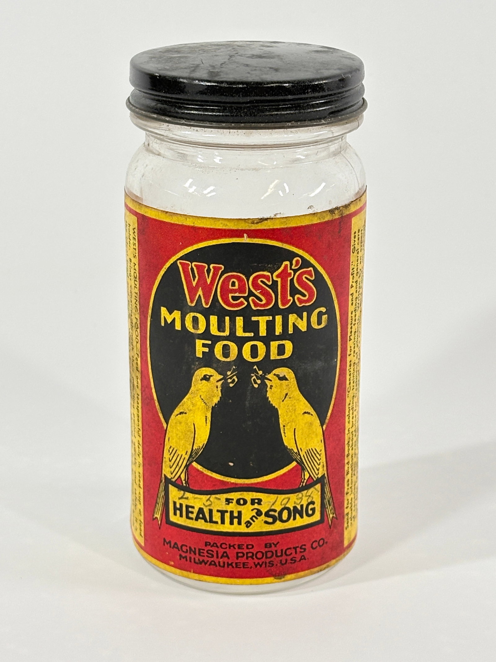 WEST'S MOULTING FOOD CANARY BIRD GLASS JAR MAGNESIA PRODUCTS: REMAINS IN GOOD CONDITION, BRIGHT GRAPHICS, LIGHT GENERAL WEAR