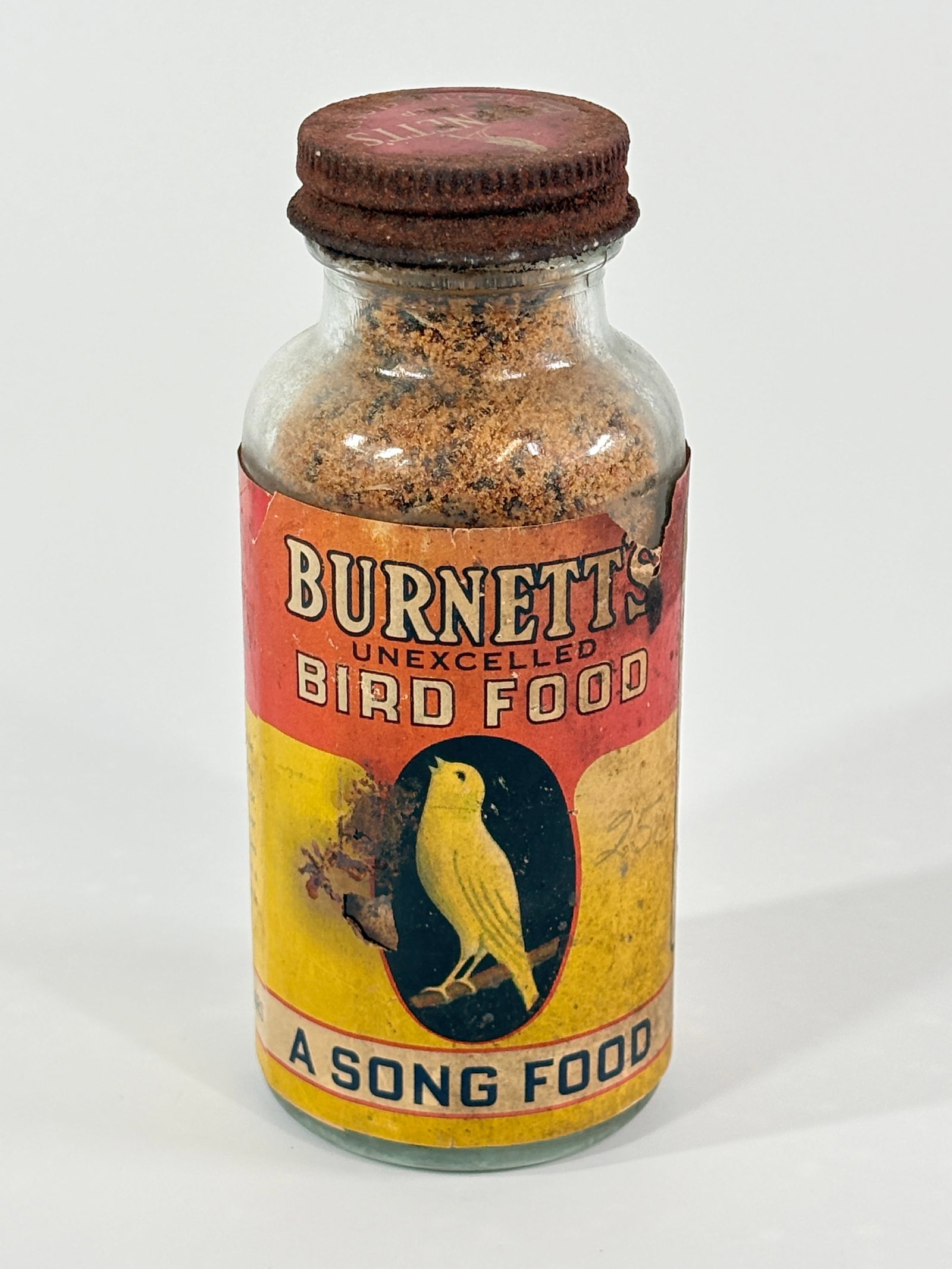 BURNETT'S CANARY BIRD FOOD GLASS JAR SONG FOOD (1 of 3)