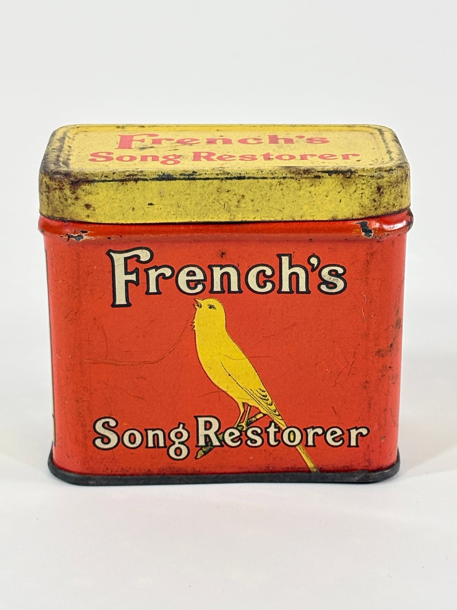 FRENCH'S SONG RESTORER CANARY BIRD TREATMENT TIN: CONTAINER REMAINS IN GOOD CONDITION, BRIGHT GRAPHICS, GENERAL WEAR / RUST