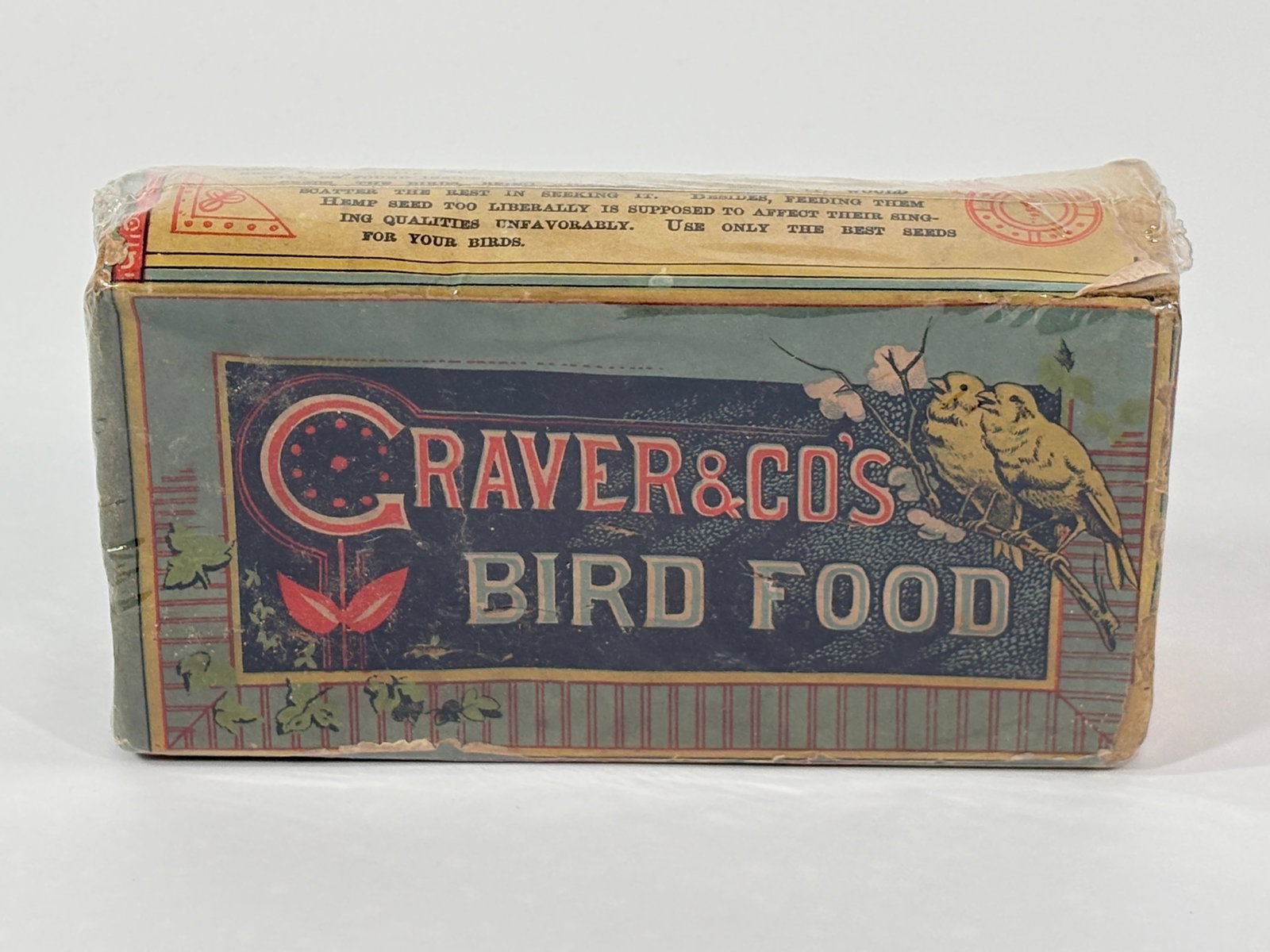 CRAVER & CO'S CANARY SONG BIRD FOOD CONTAINER: CONTAINER REMAINS IN FAIR - GOOD CONDITION, ATTRACTIVE GRAPHICS, SHRINK WRAPPED, DAMAGED PAPER LABEL