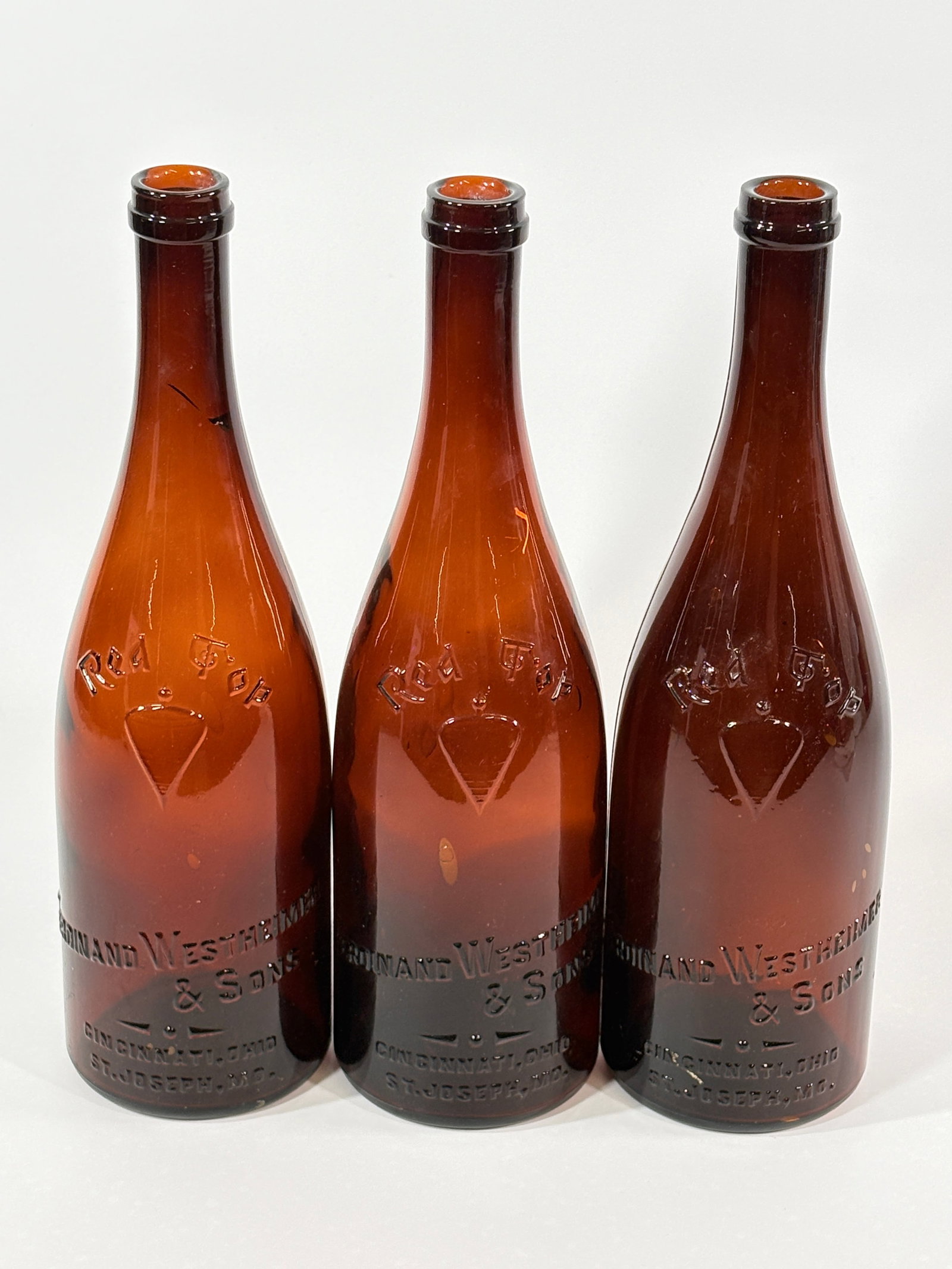 3) PRE-PROHIBITION GLASS RED TOP RYE WHISKEY BOTTLES WESTHEIMER: GROUP REMAINS IN VERY GOOD CLEAN CONDITION WITH NO NOTABLE MARKS OR WEAR