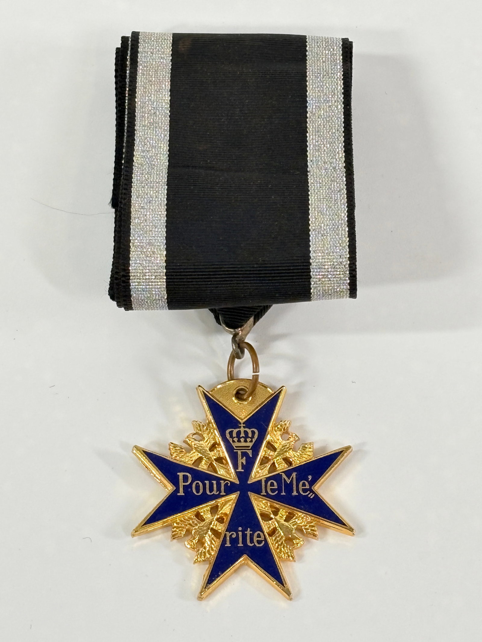 WWI PRUSSIAN BLUE MAX MILITARY MEDAL W/ RIBBON: REMAINS IN VERY GOOD CONDITION, SHOWING SOME LIGHT WEAR TO RIBBON.