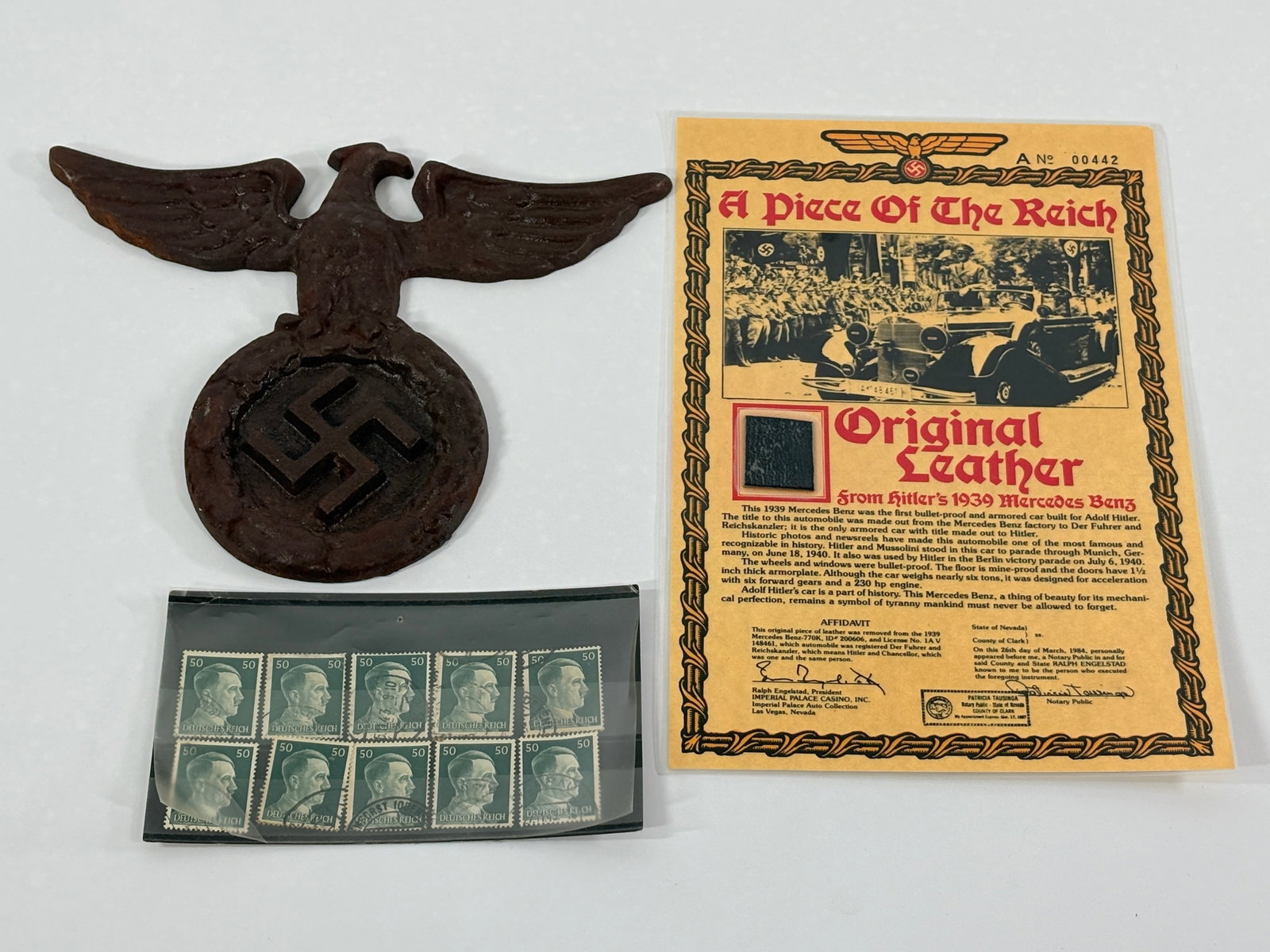 GERMAN STAMPS, METAL PLAQUE & LEATHER SWATCH: ALL REMAIN IN GOOD CONDITION.