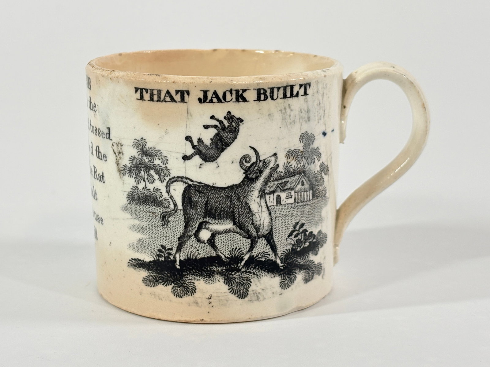 THE HISTORY OF THE HOUSE JACK BUILT TRANSFER DECORATED CHILD'S MUG: REMAINS IN FAIR TO GOOD CONDITION, SHOWING TYPICAL WEAR CONSISTENT WITH AGE & USE.