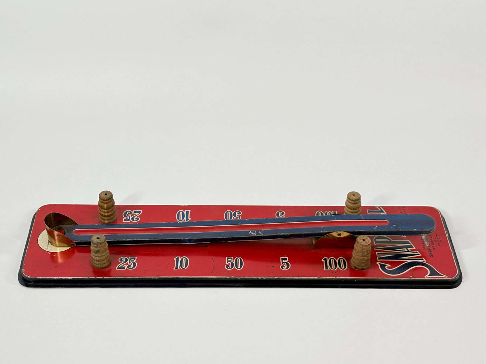 ANTIQUE SNAPBALL TIN LITHO MARBLE GAME: REMAINS IN GOOD CONDITION, SHOWING SOME TYPICAL WEAR.