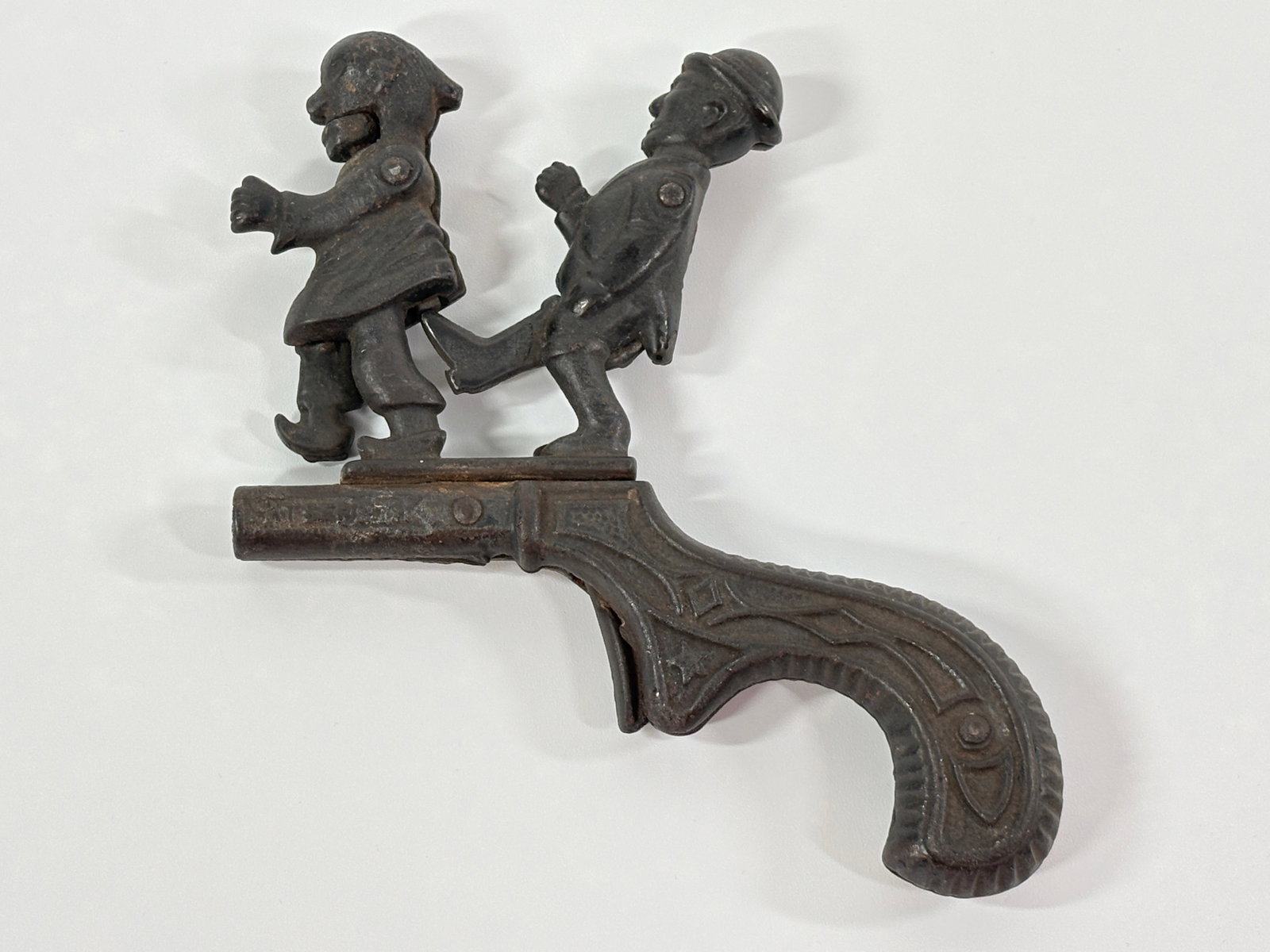 IVES CAST IRON ANIMATED CAP GUN PISTOL: REMAINS IN GOOD CONDITION, SHOWING SOME TYPICAL WEAR.