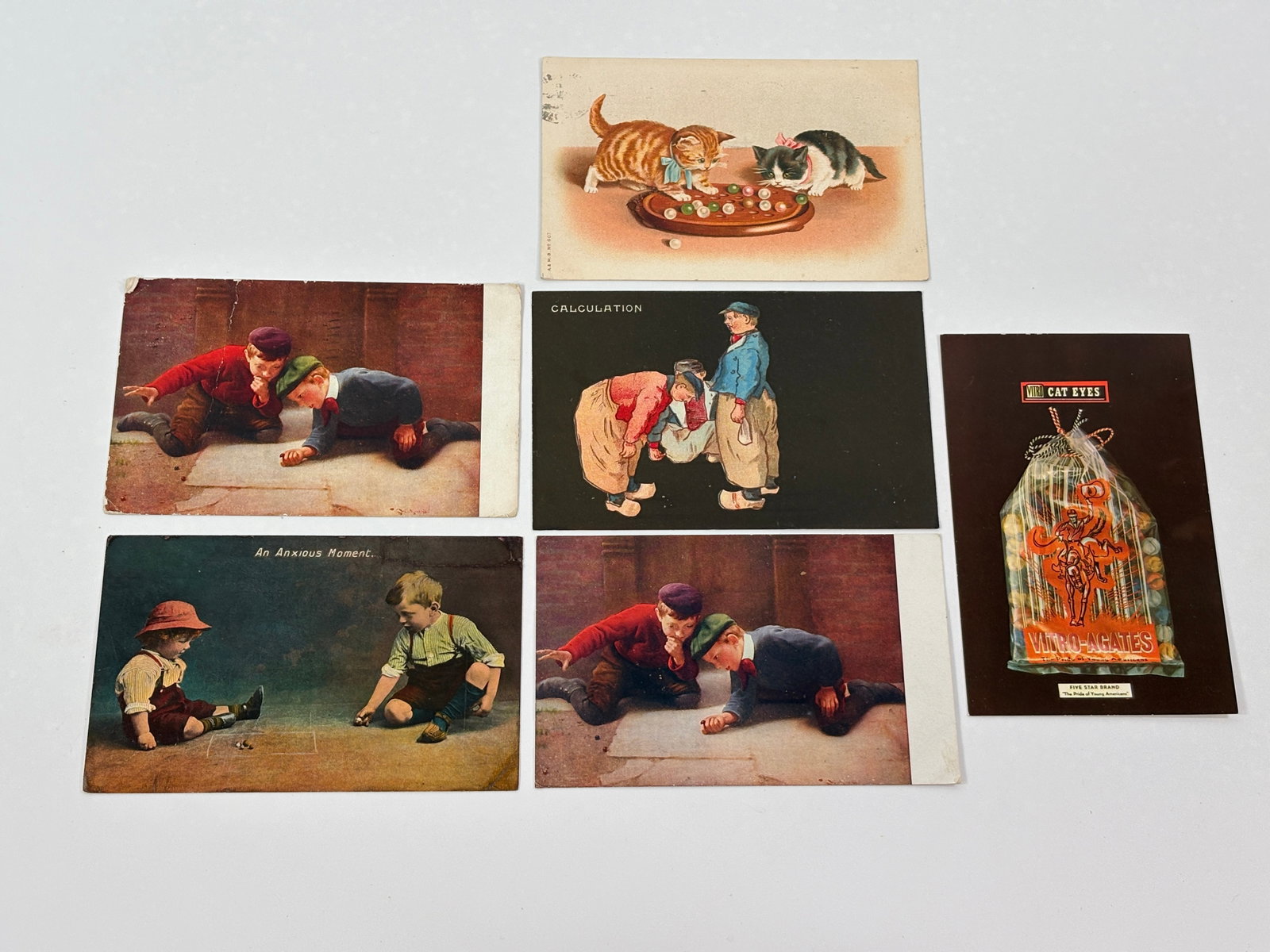 VARIOUS ANTIQUE MARBLE PLAYING POSTCARDS (1 of 5)