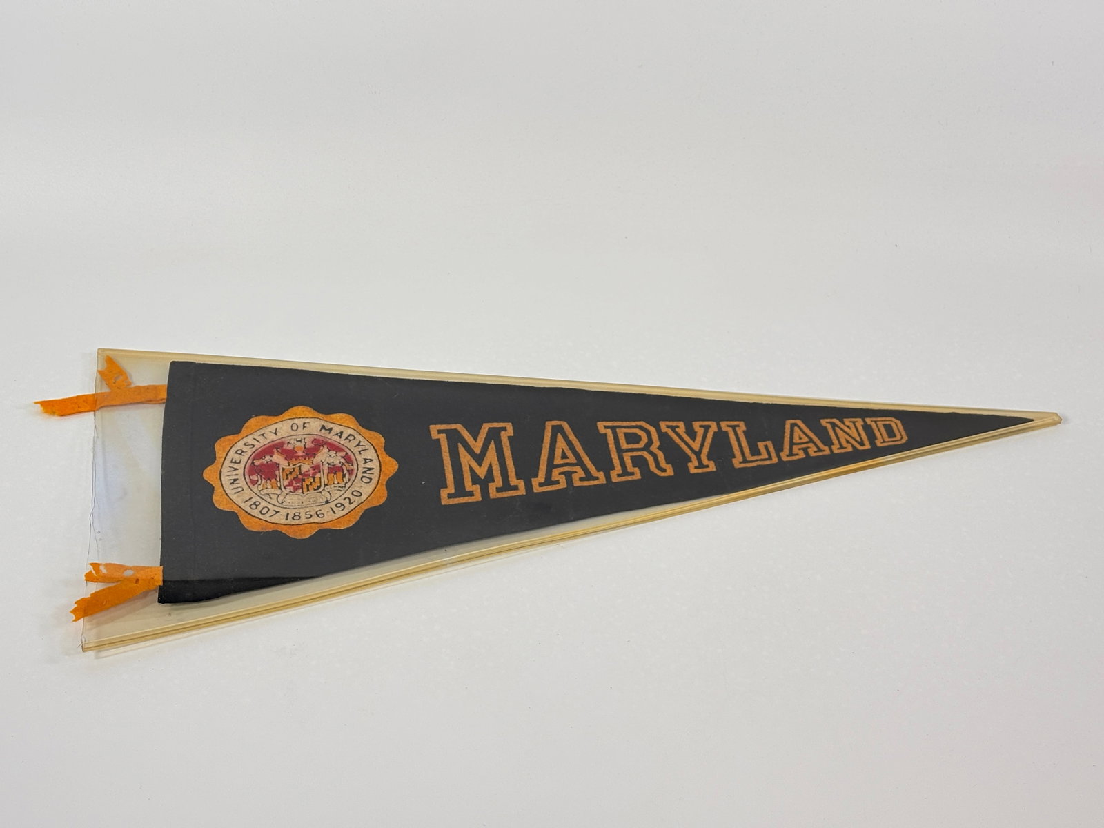 VINTAGE MARYLAND UNIVERSITY FELT PENNANT: REMAINS IN GOOD CONDITION, SHOWING SOME SMALL HOLES.