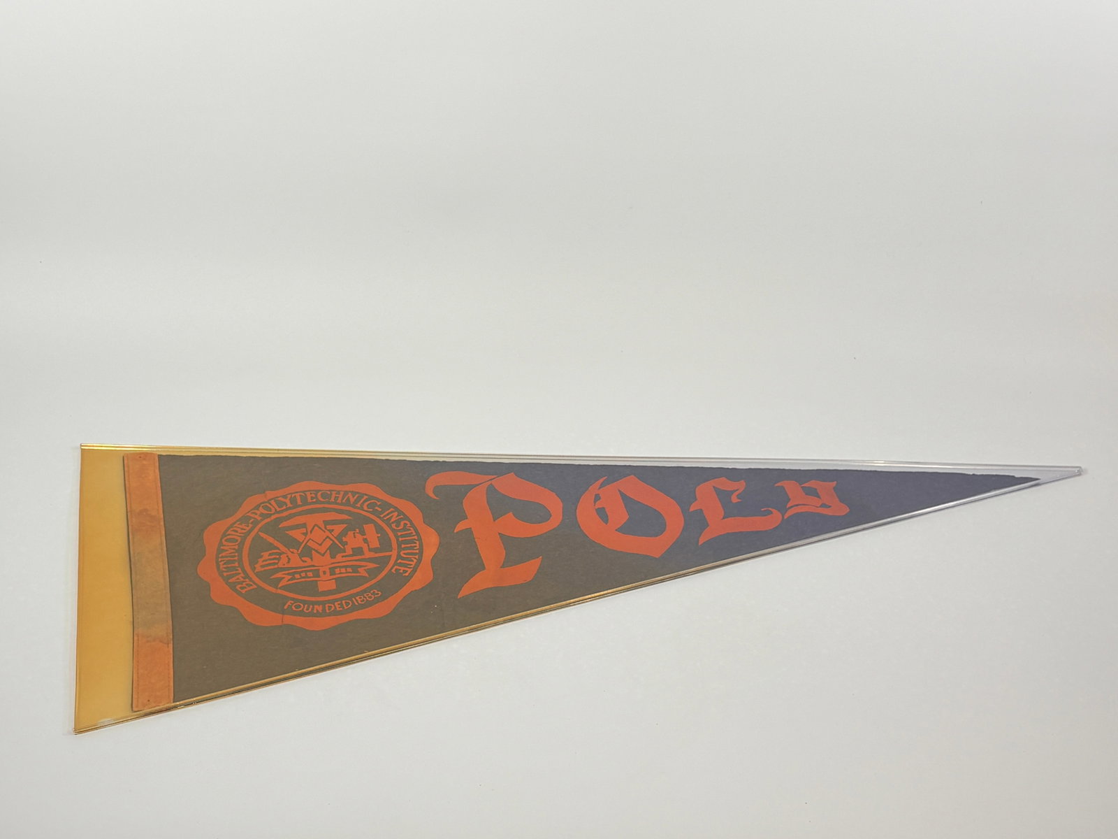 VINTAGE BALTIMORE POLYTECHNIC INSTITUTE FELT PENNANT: REMAINS IN GOOD CONDITION, SHOWING SOME LIGHT WEAR. A FEW SMALL HOLES AND SOME STAINING ALONG EDGE.