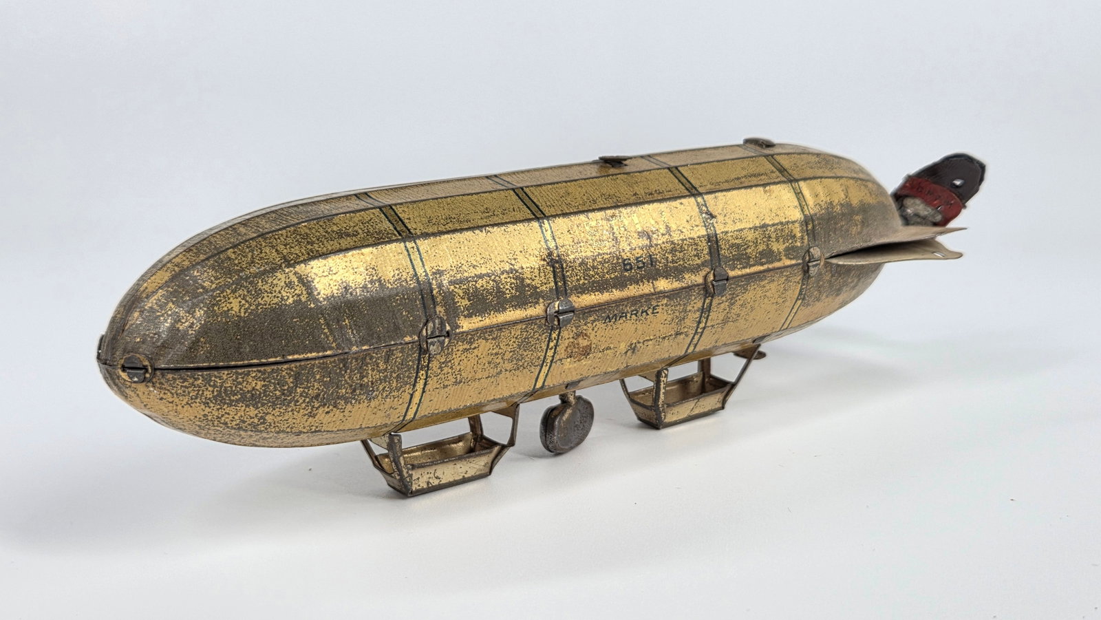 ANTIQUE DRGM LEHMANN TIN LITHO WIND UP ZEPPELIN: REMAINS IN FAIR TO GOOD CONDITION, SHOWING SOME TYPICAL WEAR. WIND UP MECHANISM DOES NOT WORK.