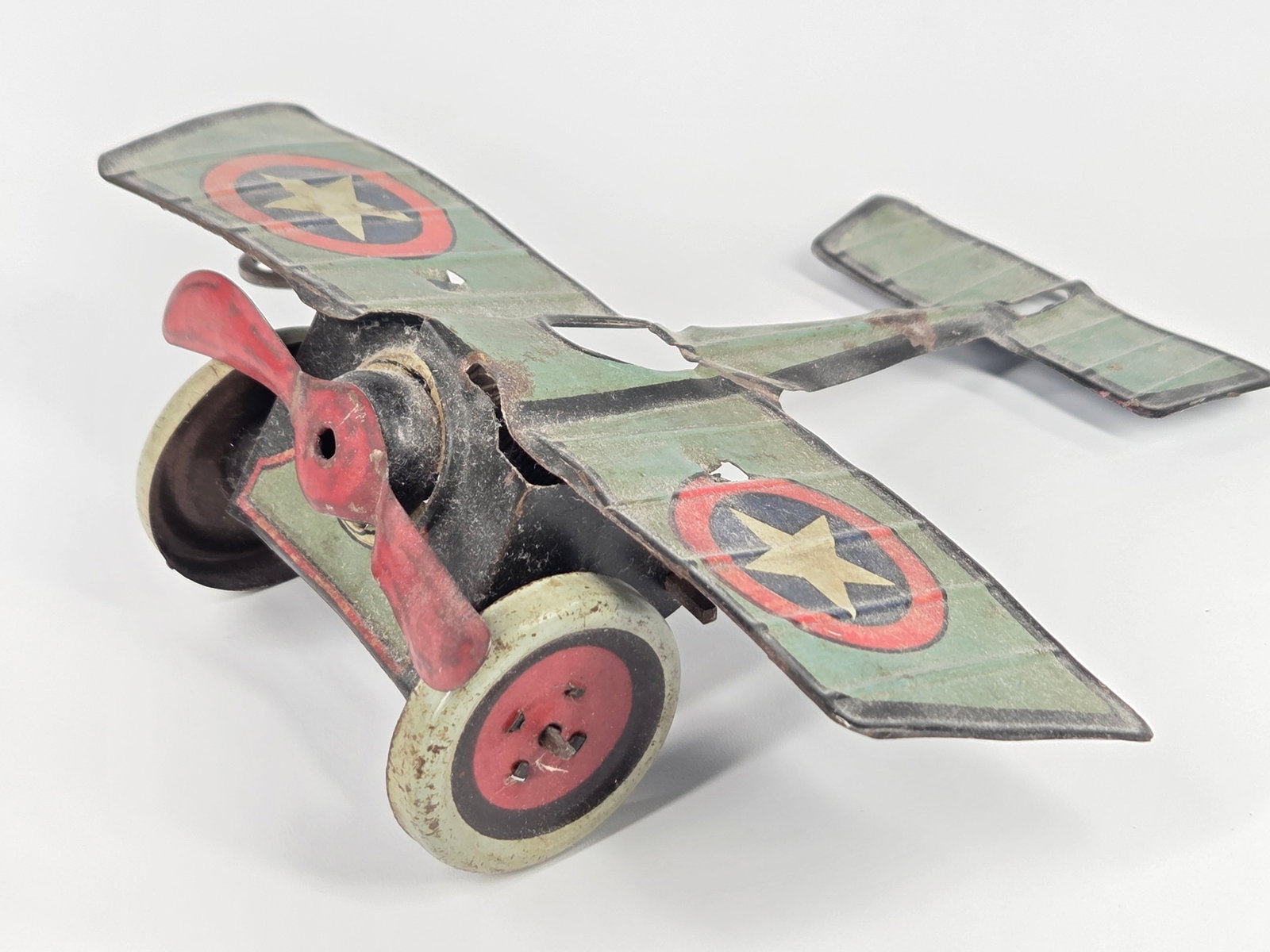 GERMAN TIN LITHO WIND UP AIRPLANE: REMAINS IN FAIR CONDITION, SHOWING TYPICAL WEAR THROUGHOUT. WIND UP MECHANISM DOES NOT WORK.
