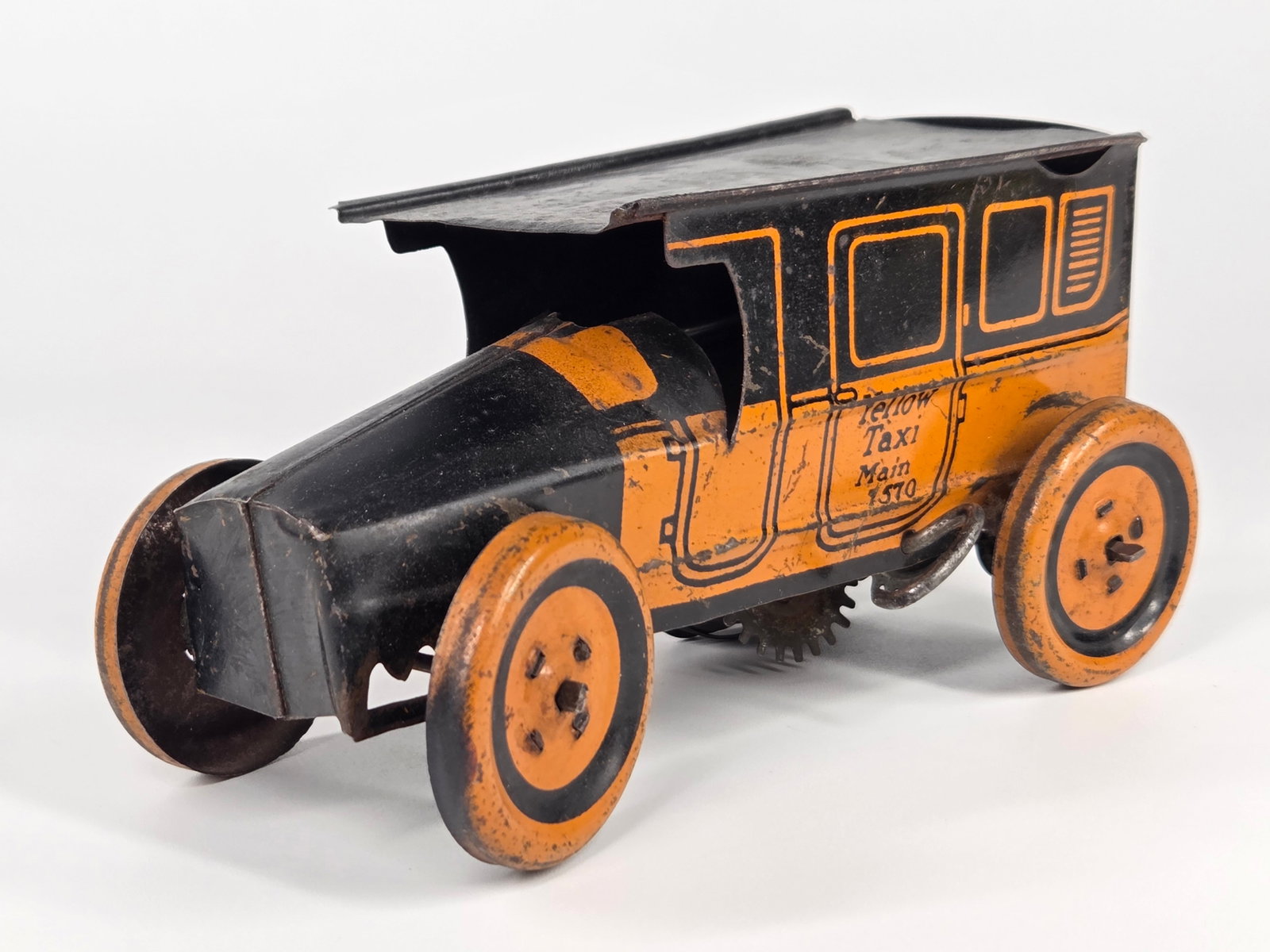 J. CHEIN & CO. TIN LITHO WIND UP YELLOW TAXI CAB: REMAINS IN FAIR TO GOOD CONDITION, SHOWING SOME TYPICAL WEAR. WIND UP MECHANISM DOES NOT WORK.