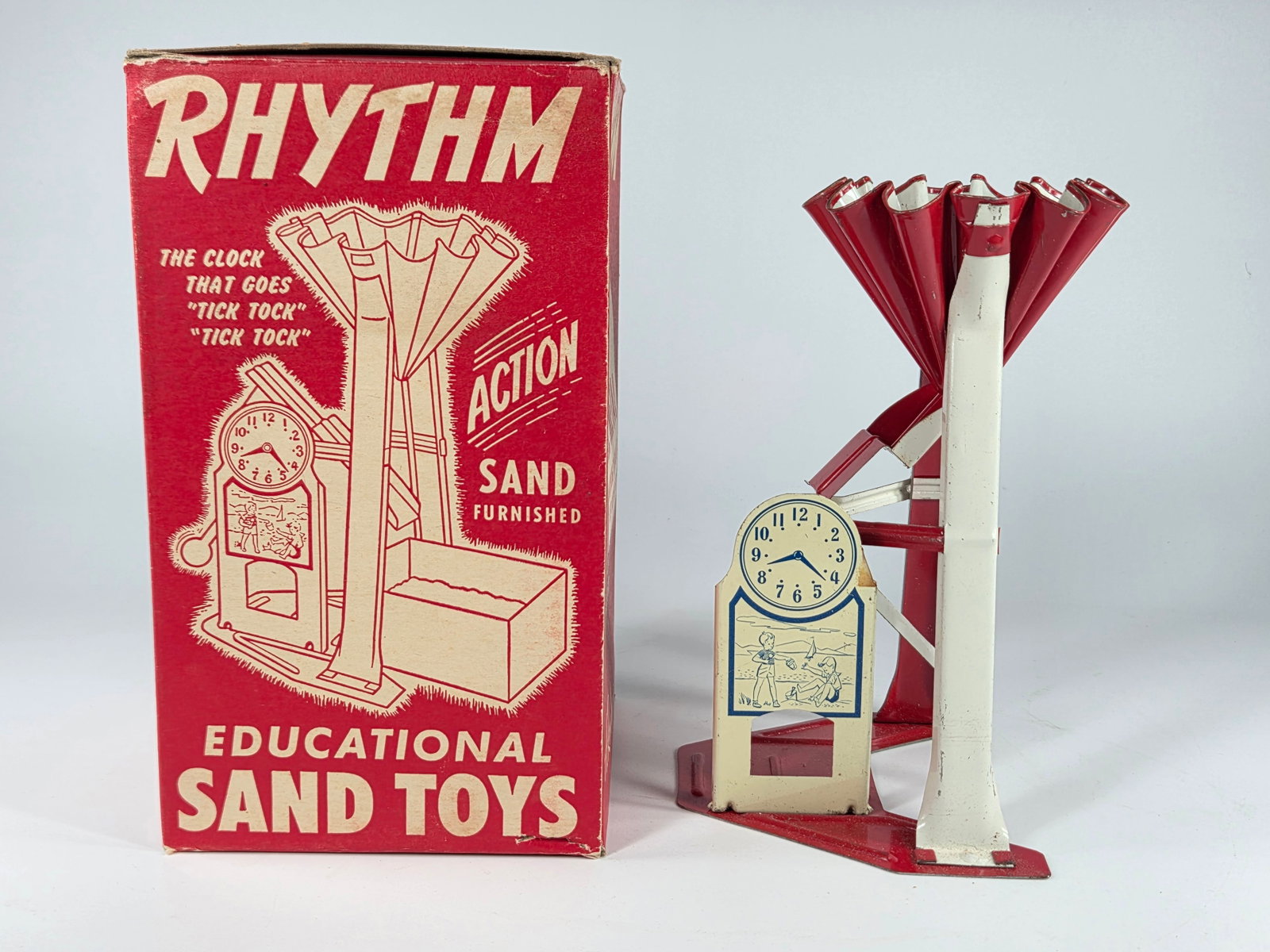 VINTAGE RHYTHM EDUCATIONAL SAND TOY W/ BOX: REMAINS IN VERY GOOD CONDITION, SHOWING SOME LIGHT WEAR. ORIGINAL BOX REMAINS NICE.