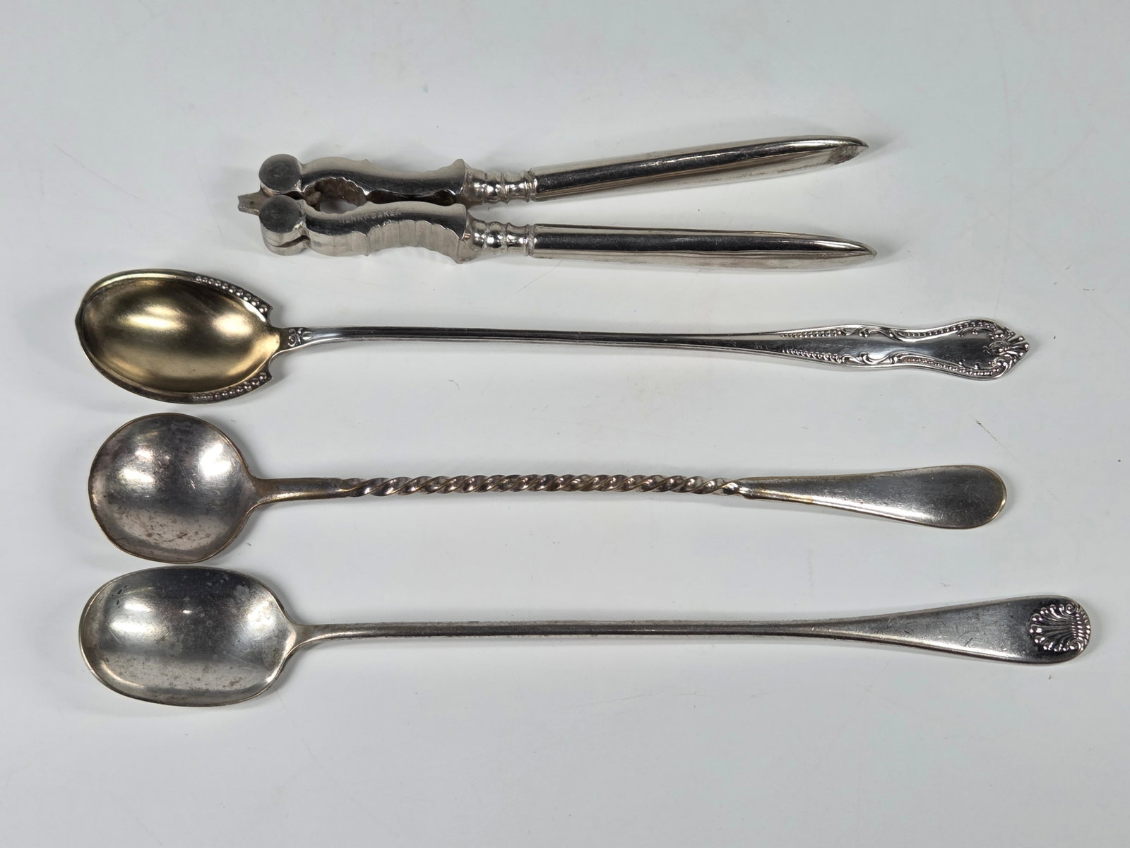 ASSORTED ICE TEA SPOONS & NUTCRACKER TOWLE BOKER: GROUP REMAINS IN GOOD CONDITION - SOME GENERAL WEAR