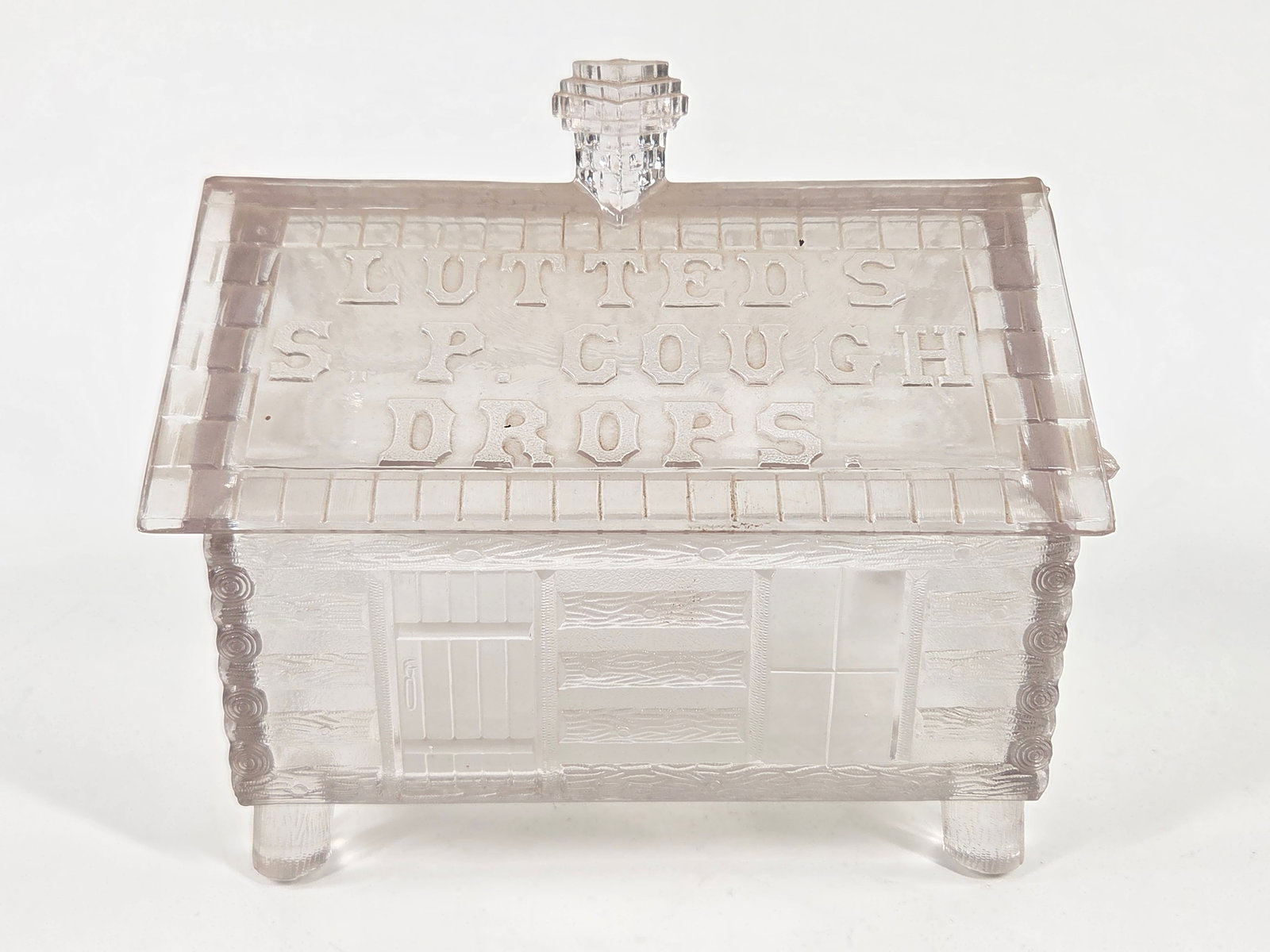 LUTTED'S PRESSED GLASS FIGURAL LOG CABIN COUGH DROP DISPLAY JAR: REMAINS IN GOOD CONDITION - CHIP ON BOTTOM OF FOOT