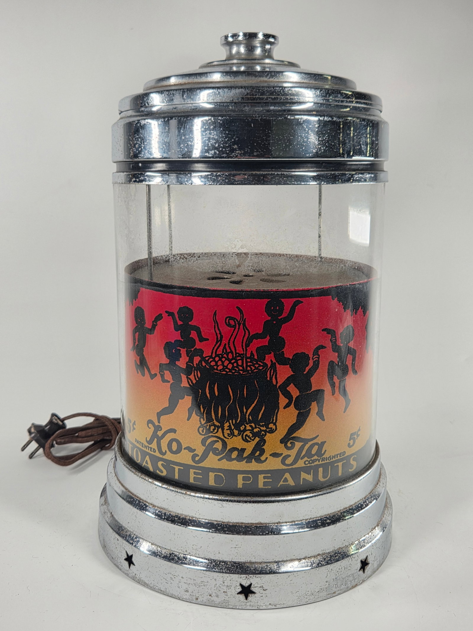KO-PAK-TA TOASTED NUTS WARMER VENDING MACHINE ROY STRINGER: REMAINS IN VERY GOOD CONDITION - MILD CHROME PITTING - BRIGHT GRAPHICS - COMPLETE - WORN CLOTH CORD